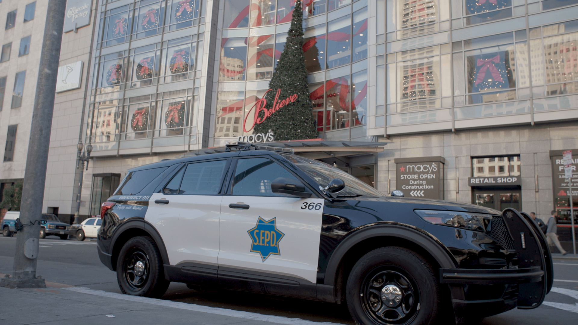 good books you can find at the library A San Francisco police SUV is parked outside a storefront adorned with a Christmas tree.