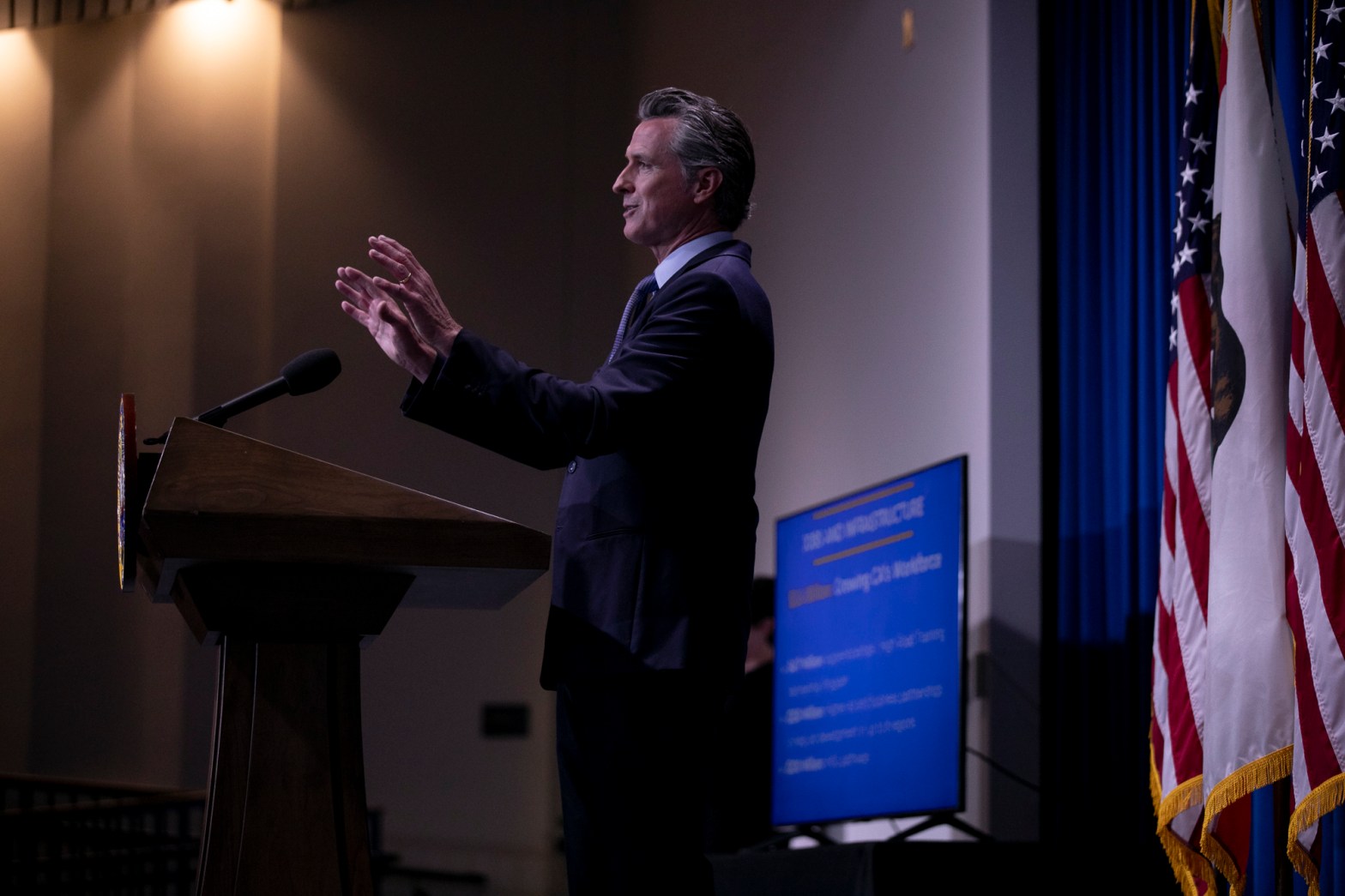 Gov. Gavin Newsom presents the breakdown for his revised budget at the Secretary of State building auditorium in Sacramento on May 14, 2021. The proposal focused on education, housing and climate resiliency measures.