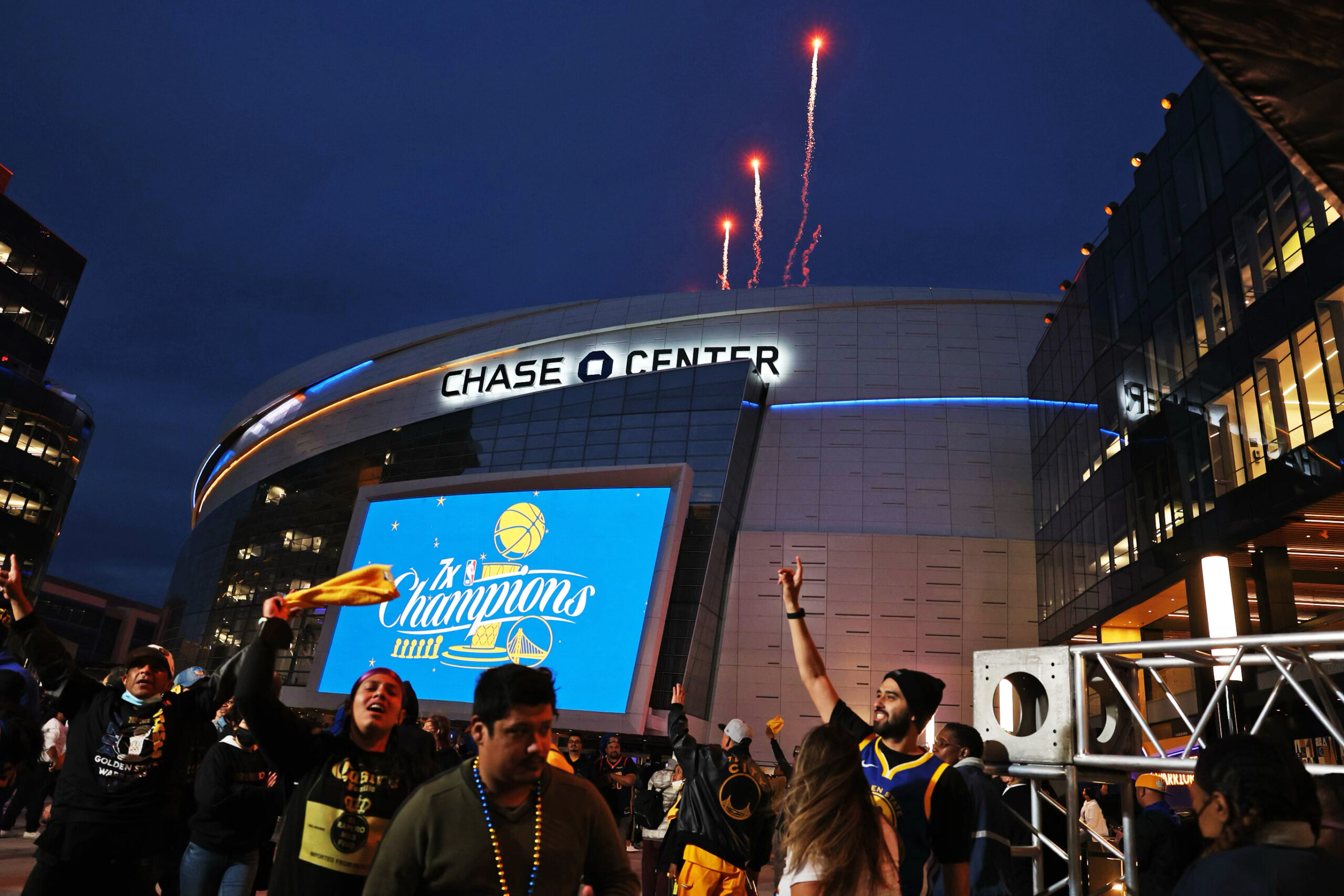 Fireworks explode and fans cheer to celebrate outside Chase Center.