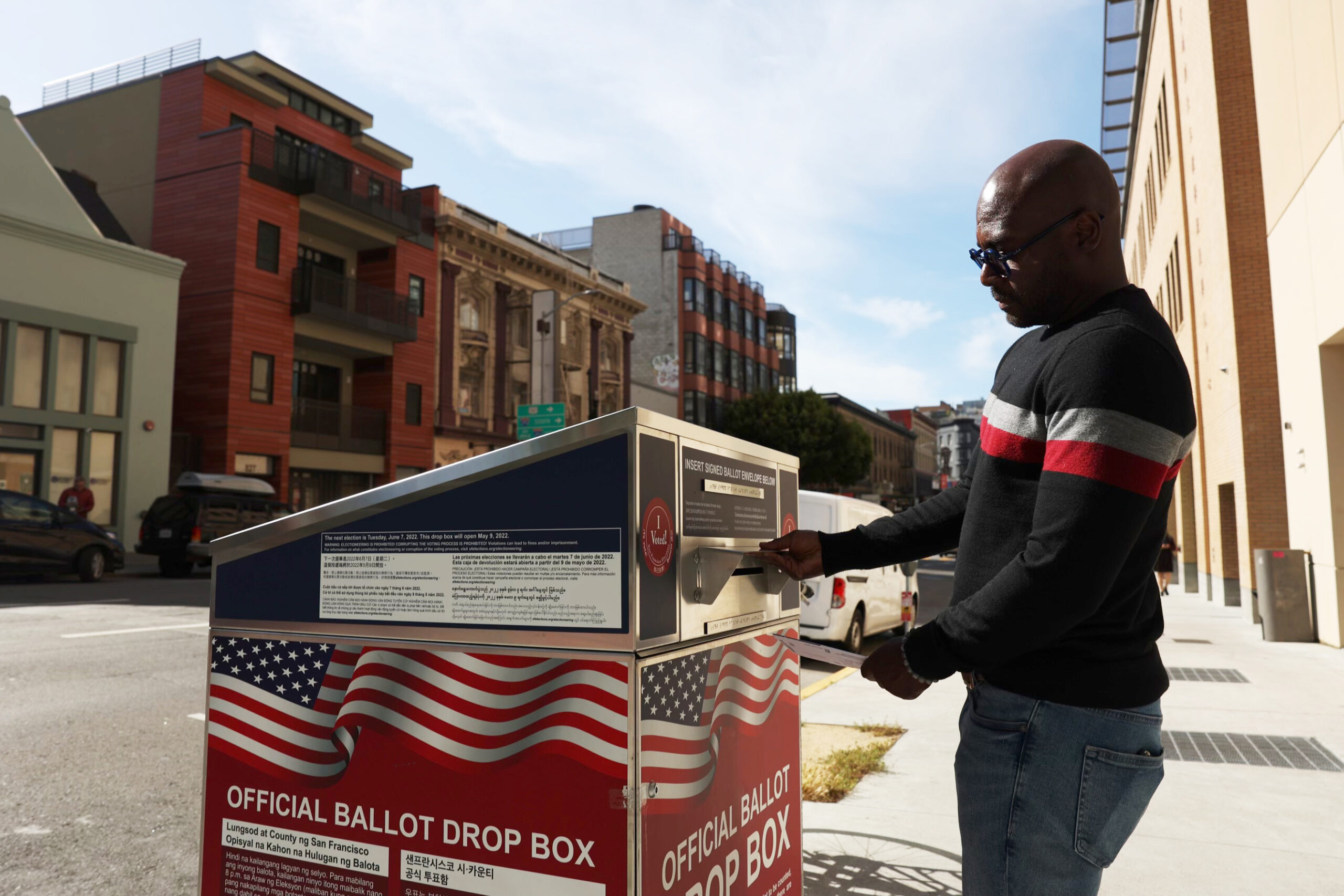 Earnest Sanders deposits his ballot at an official ballot drop box outside City College of San Francisco, Chinatown / North Beach Campus at 808 Kearny St. on Tuesday, June 7, 2022 in San Francisco, Calif.
