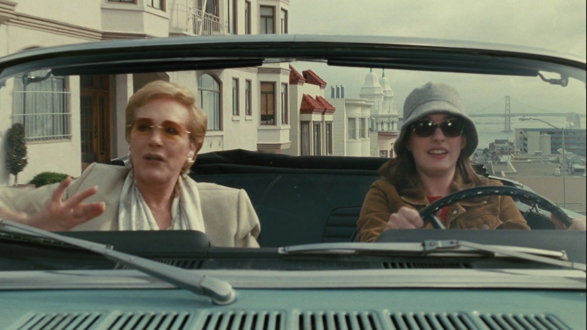 Two actresses in a Ford Mustang.