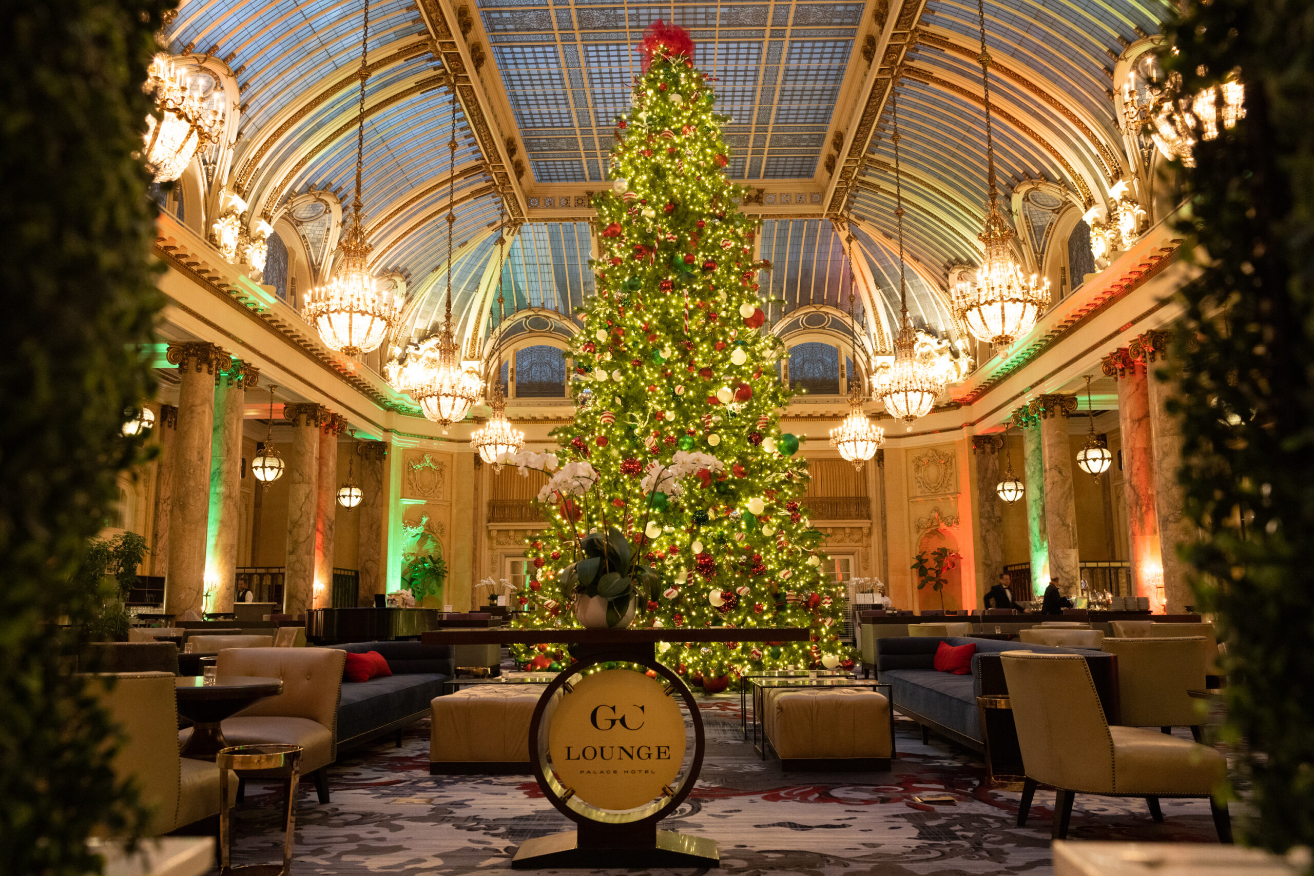 A 40-foot-tall Christmas tree stands in the glass-ceilinged Garden Court of the regal Palace Hotel in San Francisco, California.