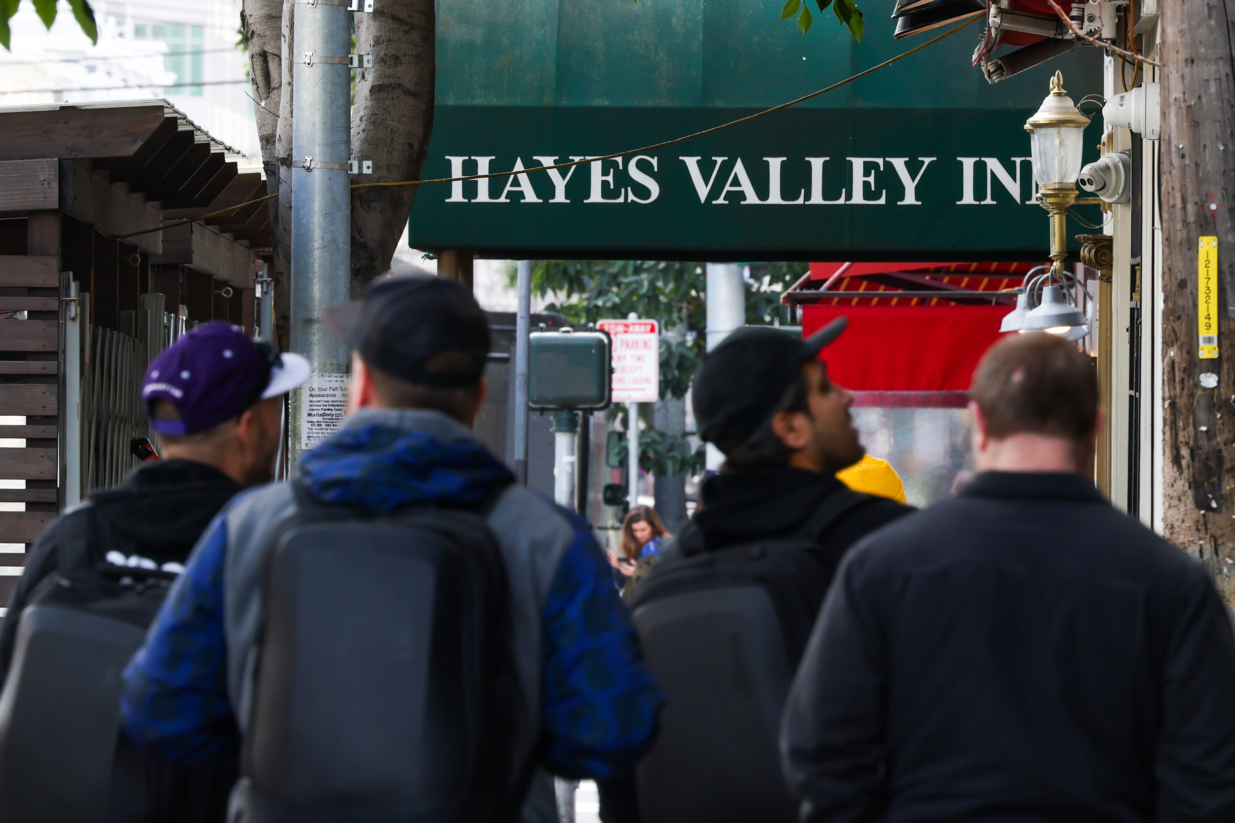 Pedestrians walking on a street in Hayes Valley in San Francisco.