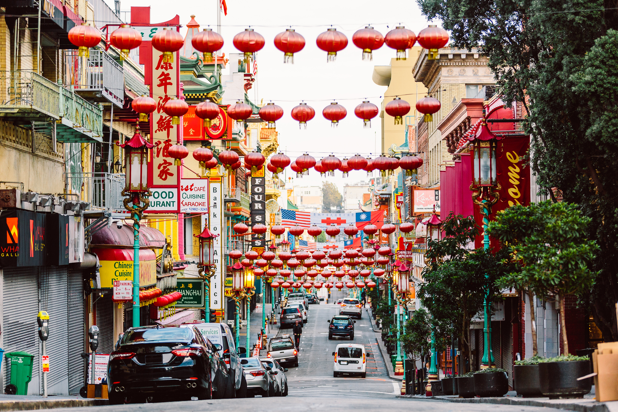 A line of red lanterns hang across a street in San Francisco's Chinatown.