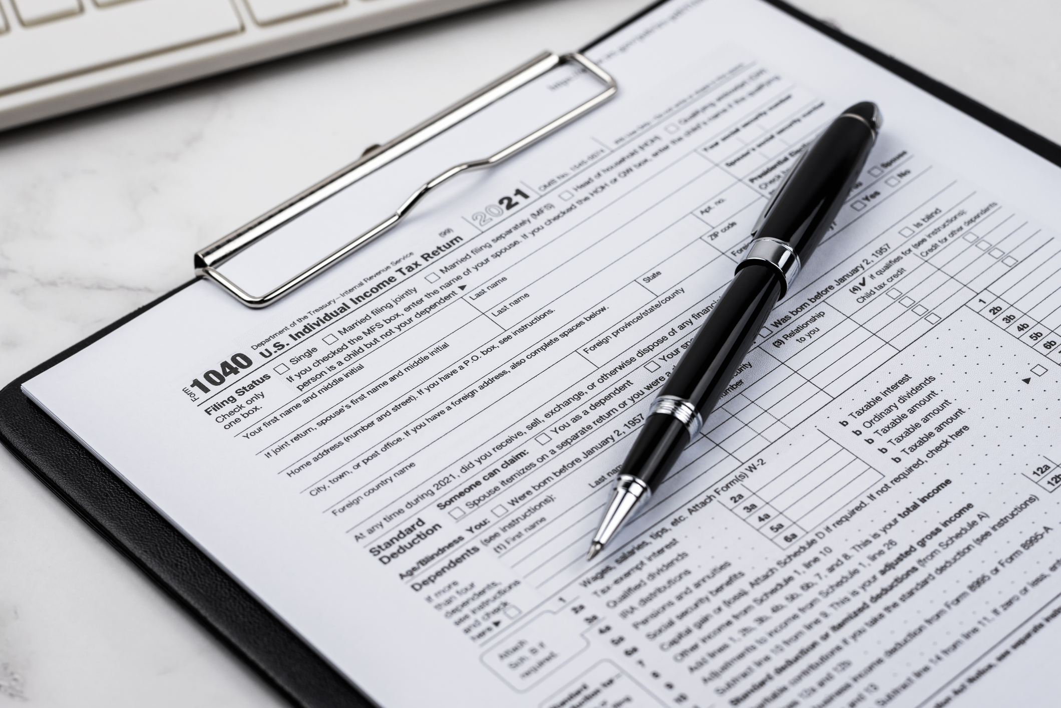 A photo shows a close-up of a Form 1040 tax form.