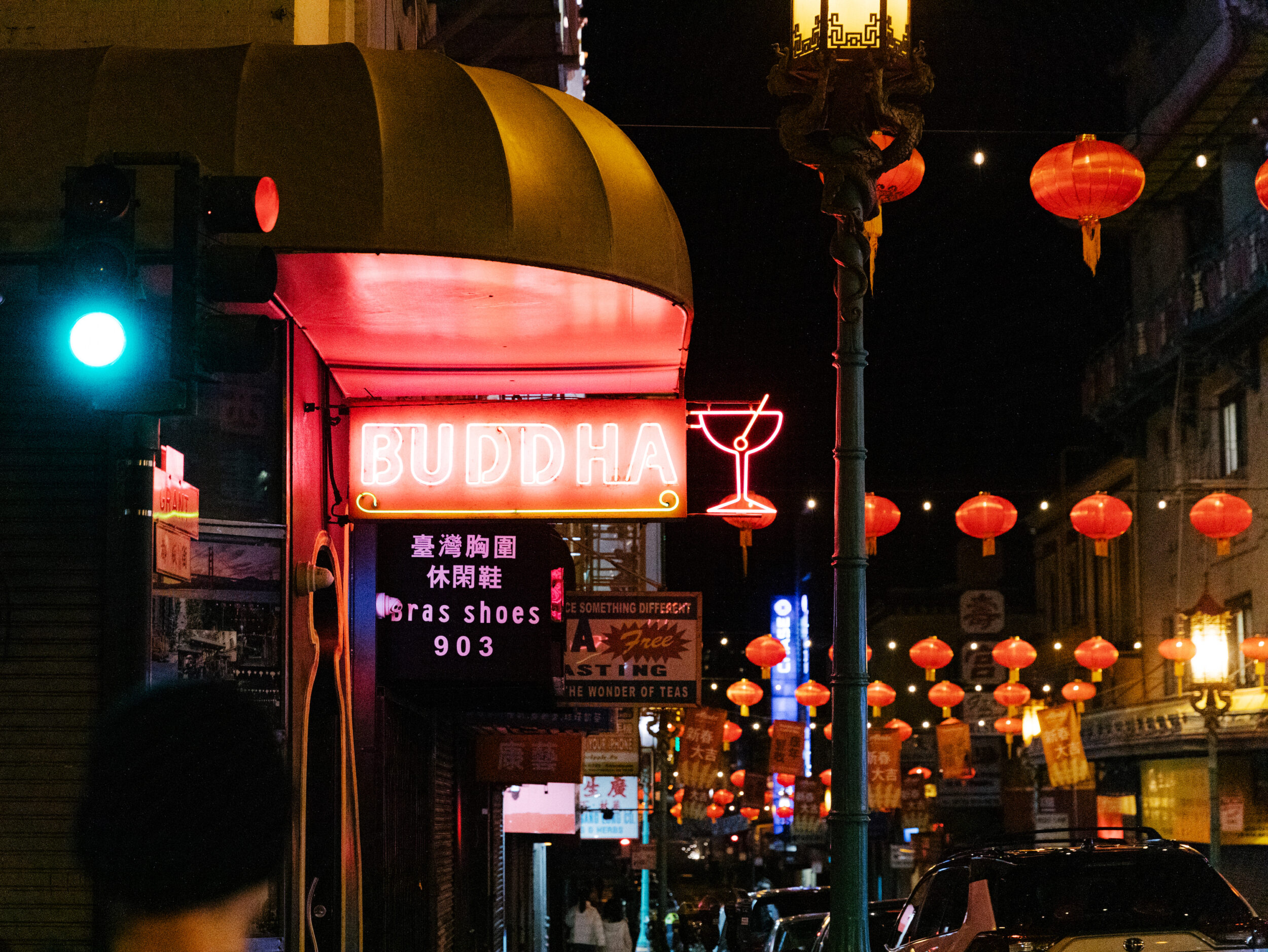 The red neon of Buddha lounge shines in the darkness in San Francisco's Chinatown.