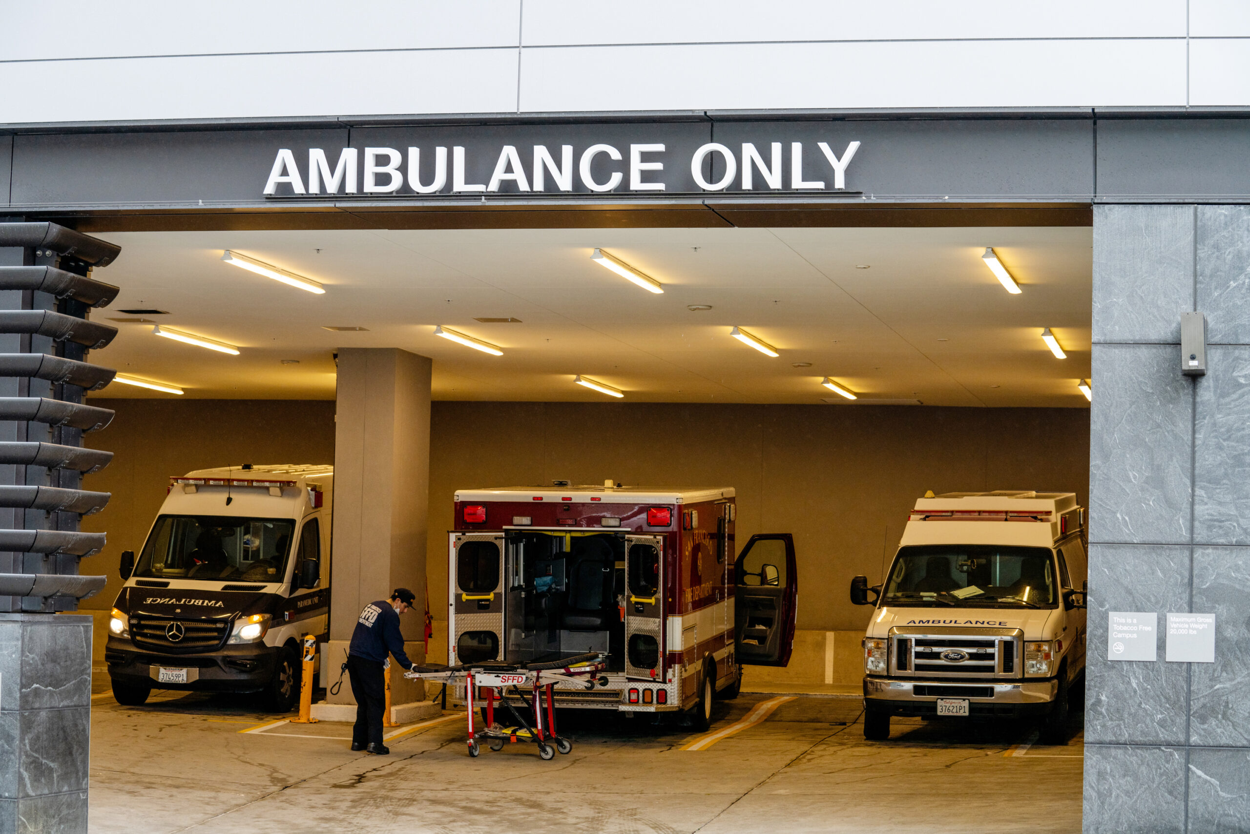 Three ambulances parked inside parking lot