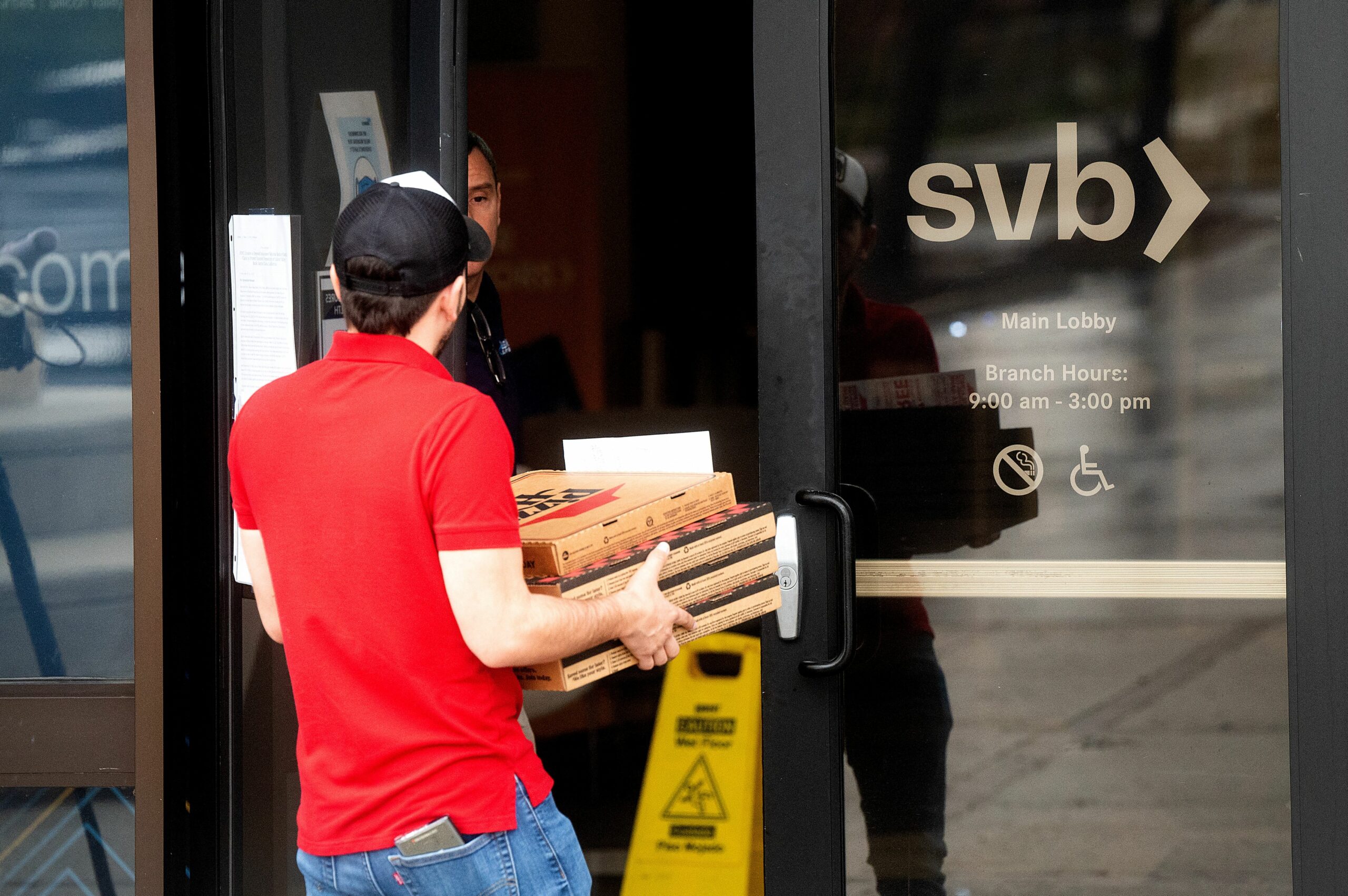 Silicon Valley Bank HQ Photos: Staff Order Pizza as People Gather Outside