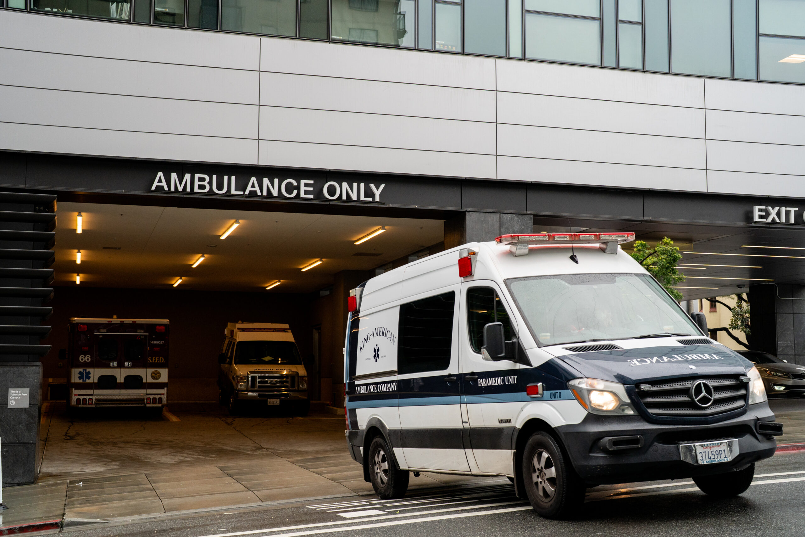 An ambulance backs into an ambulance bay at a hospital