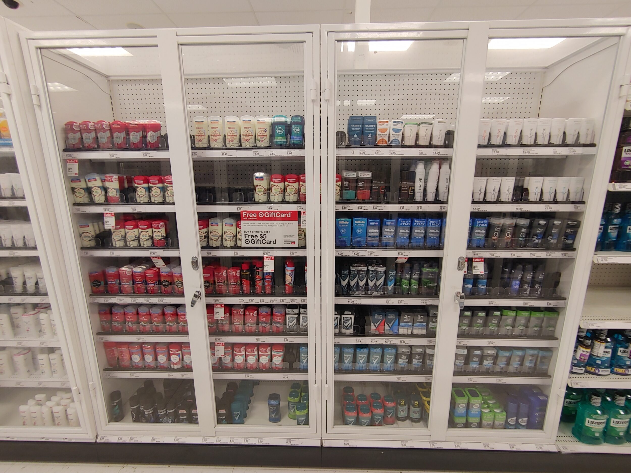 items are locked behind plexiglass in a department store
