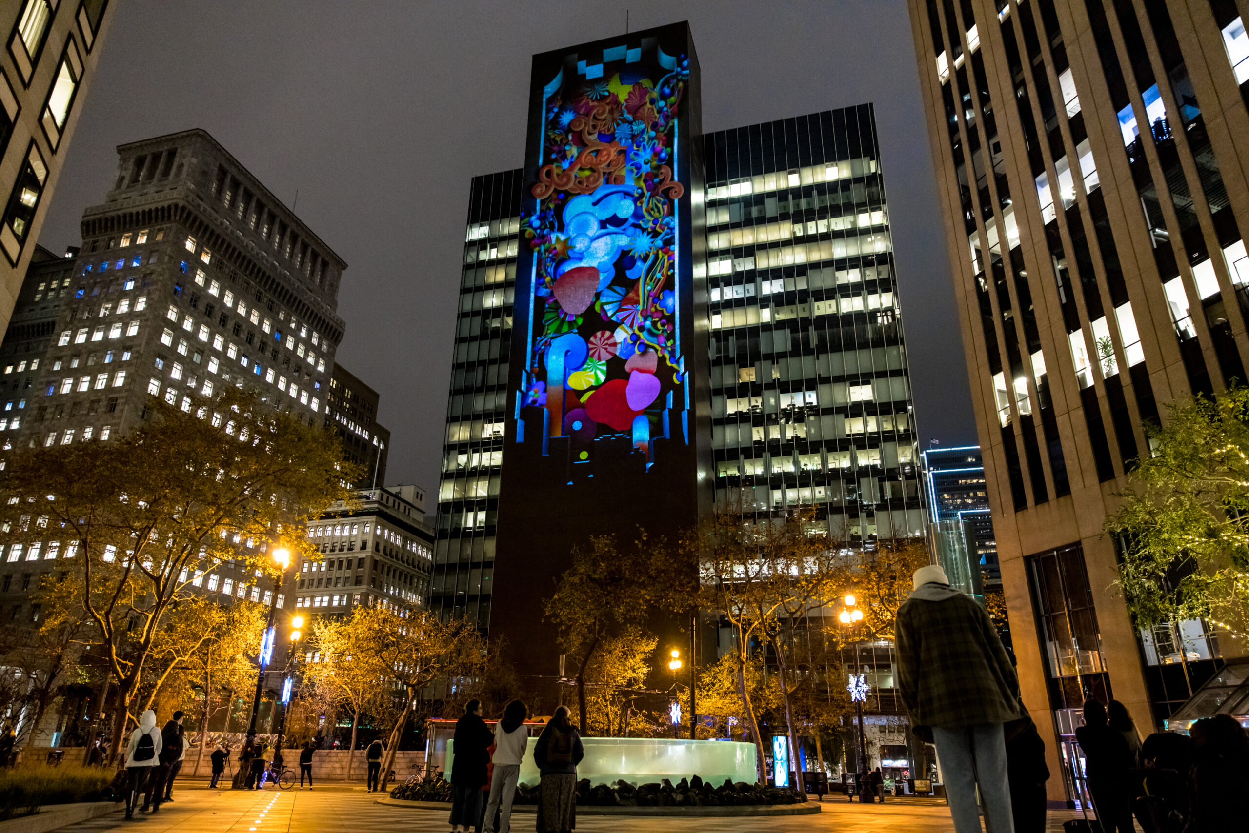 A projection lights up One Bush Plaza, a skyscraper in Downtown San Francisco