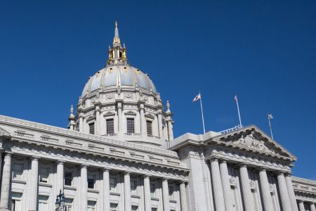 An exterior photo of San Francisco City Hall on a sunny day.