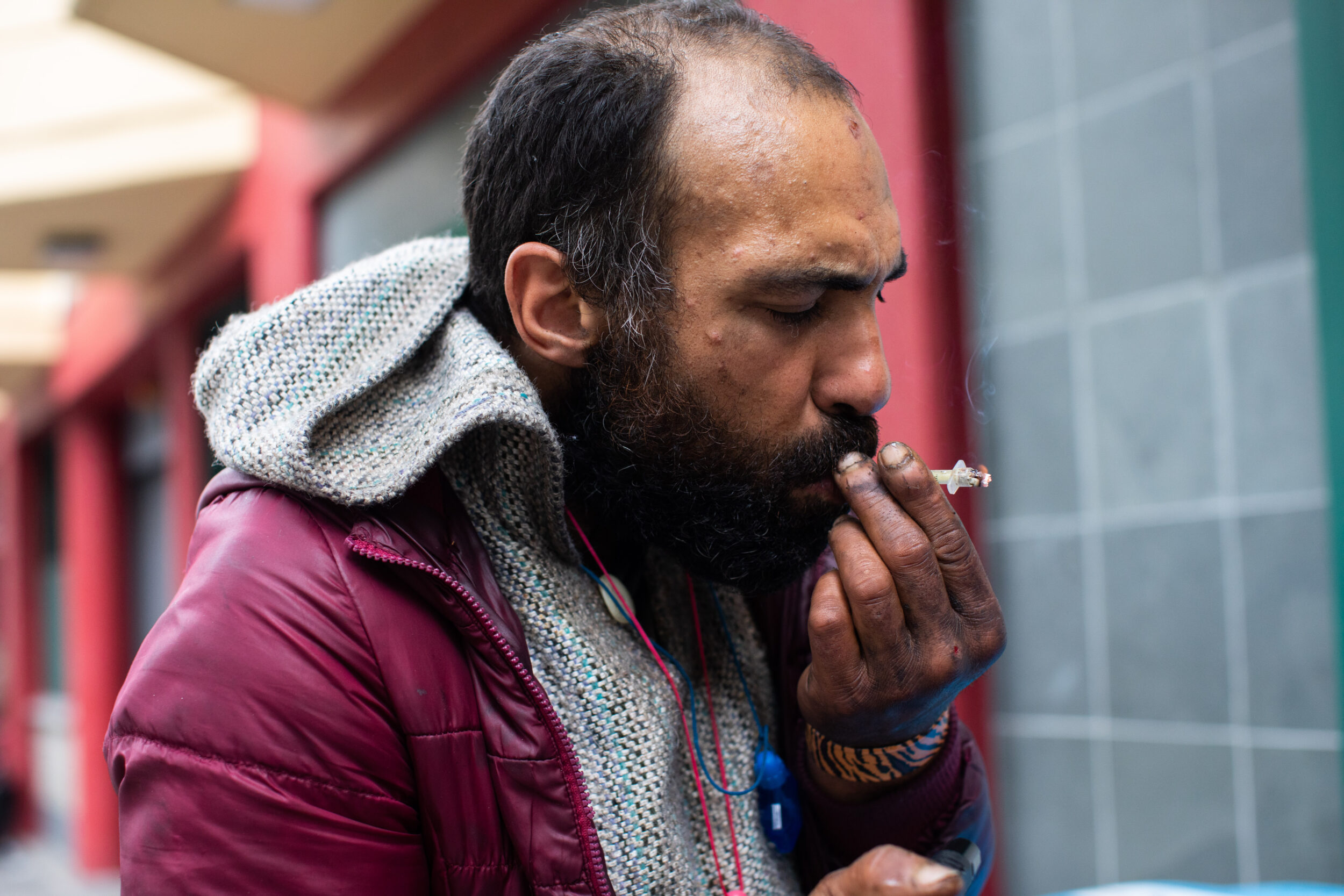 A man using drugs on the street