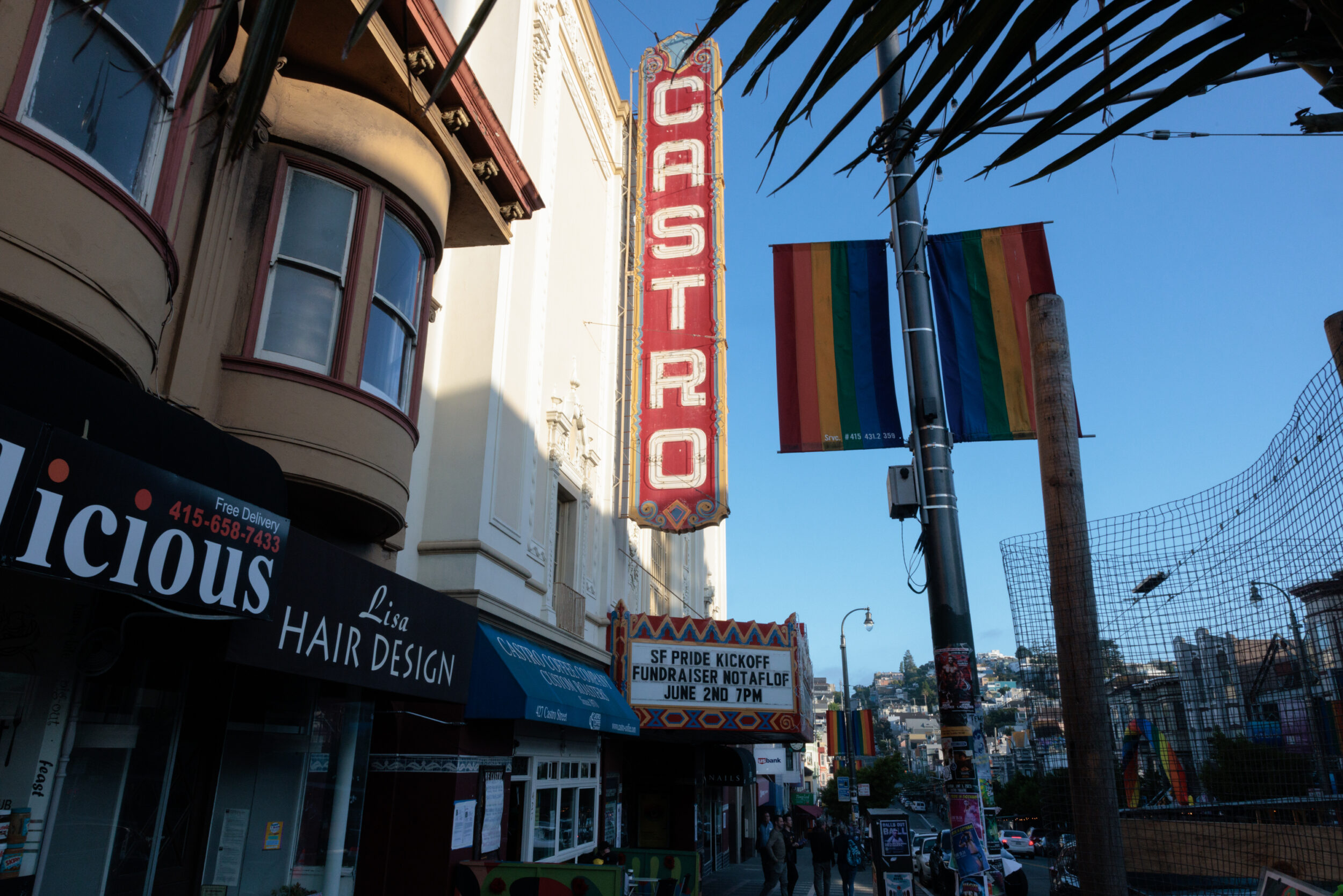 A sign for the Castro theatre illuminated by sunlight.