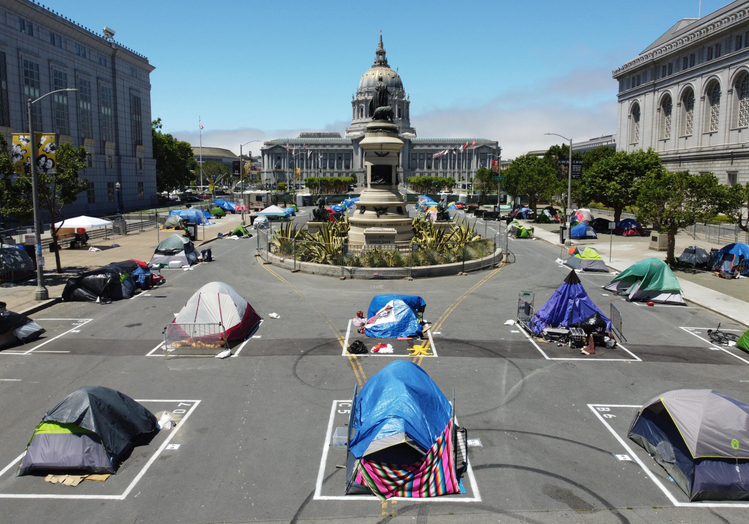 San Francisco City Hall in the distance with tents in the foreground.