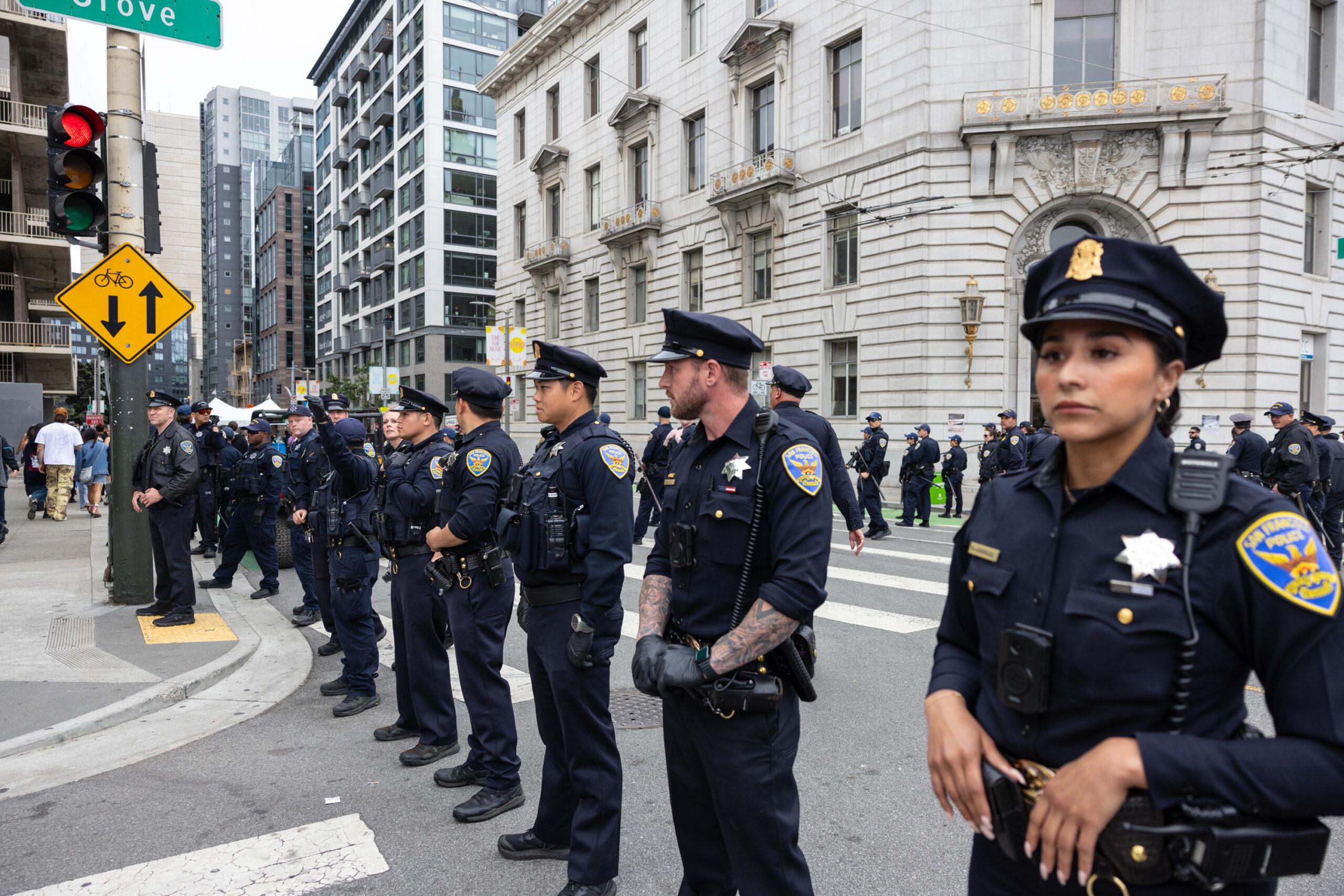 Police officers line street at Pride parade