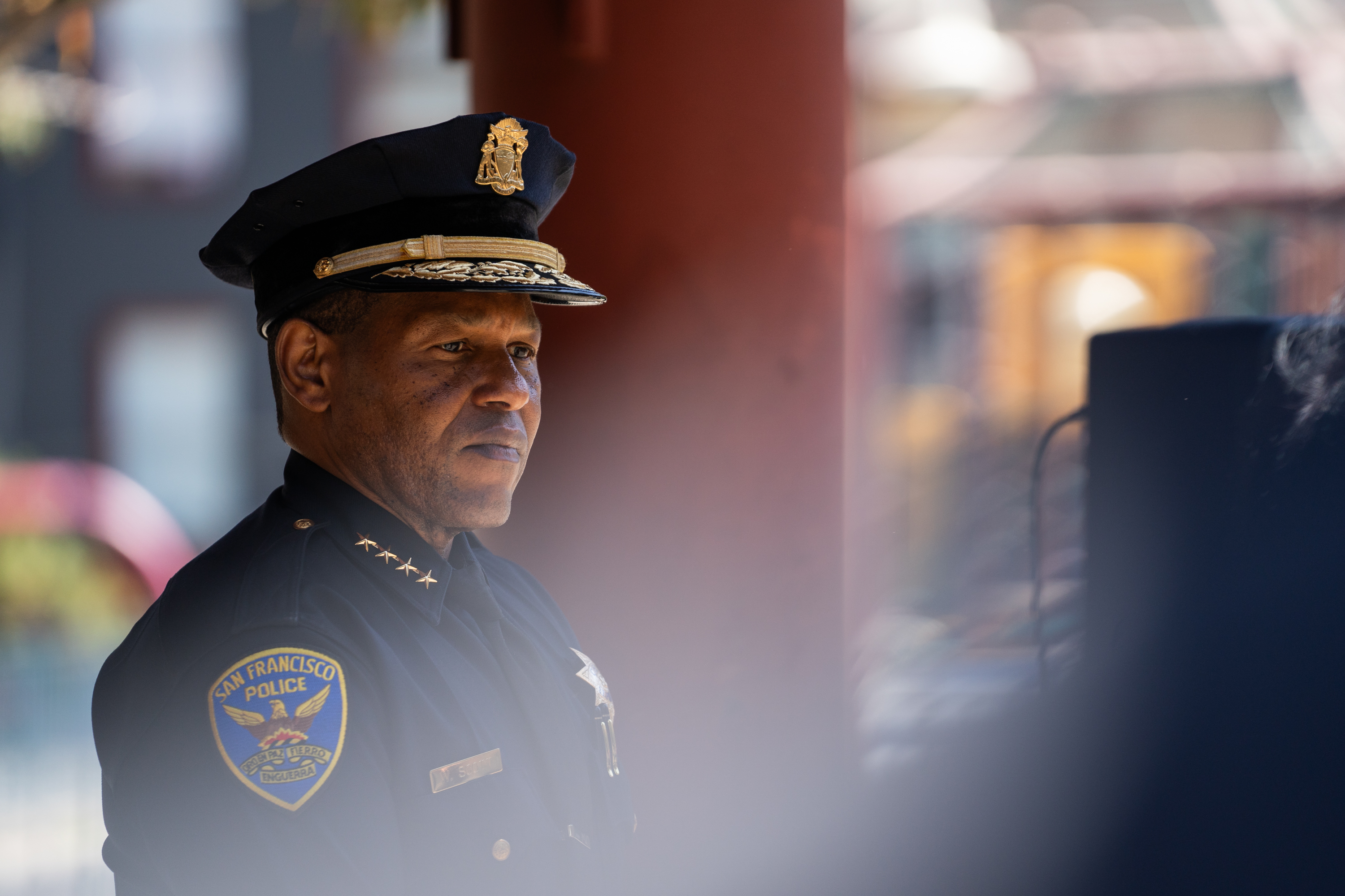 A police chief stands at an event.