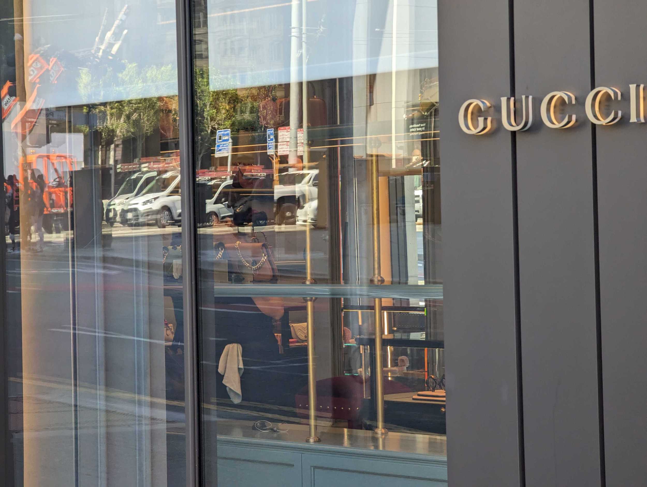 A worker readies to open the flagship Gucci Store in San Francisco's Union Square shopping district Tuesday | George Kelly/The Standard