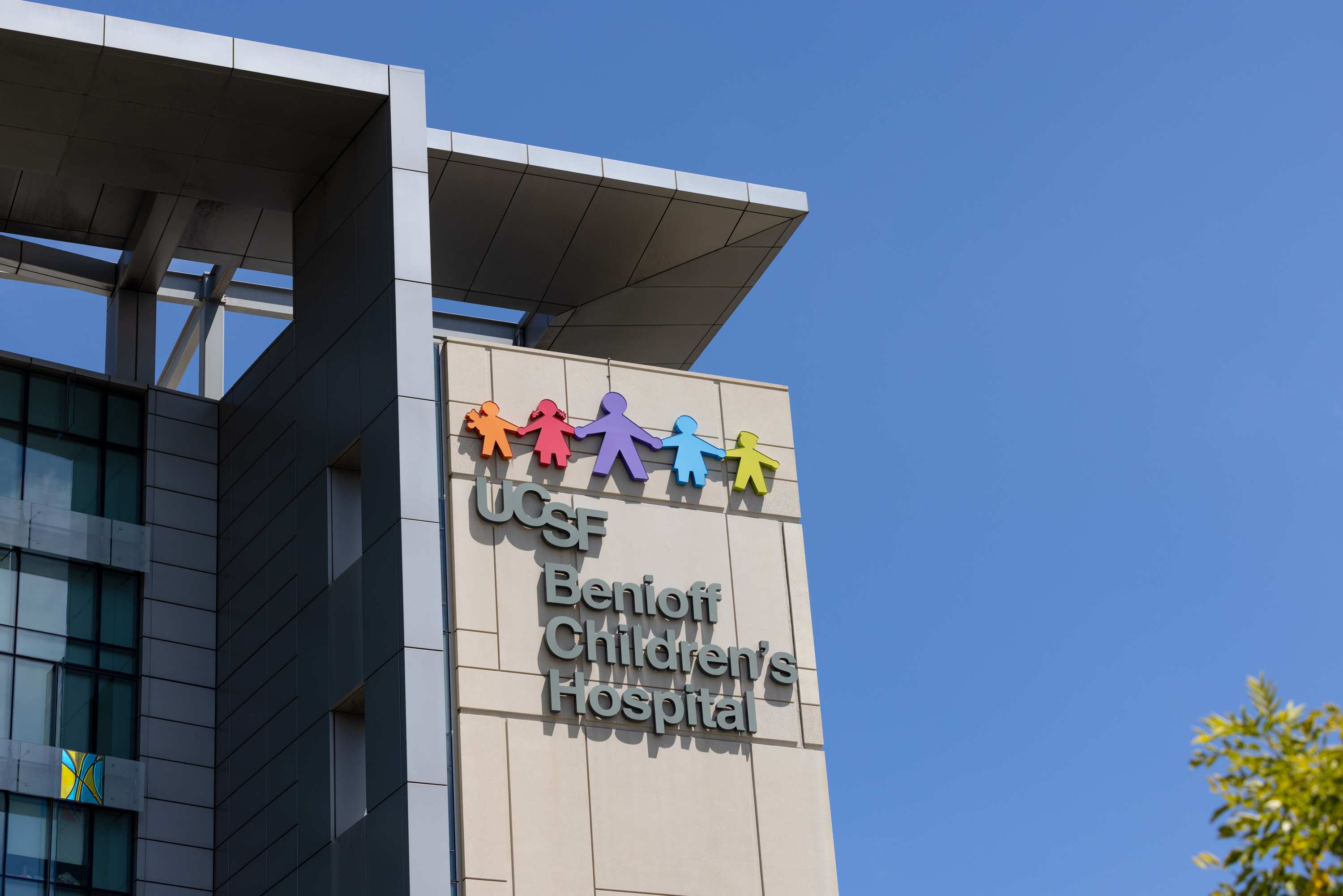 A hospital building exterior shows the logo for UCSF's Benioff Children's Hospital