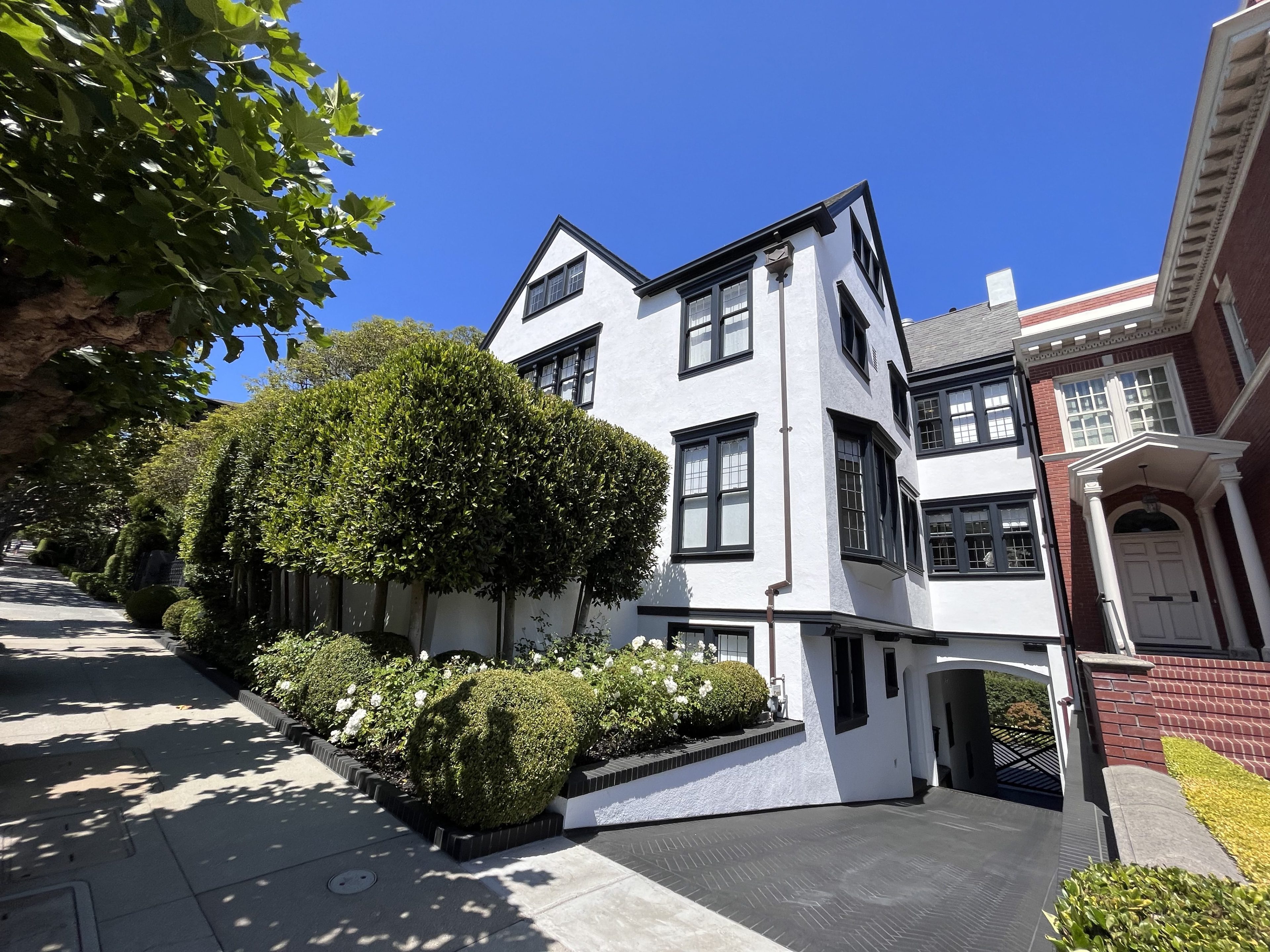 A white house with a black roof and window trim is worth $36 million in San Francisco's elite Presidio Heights neighborhood. 