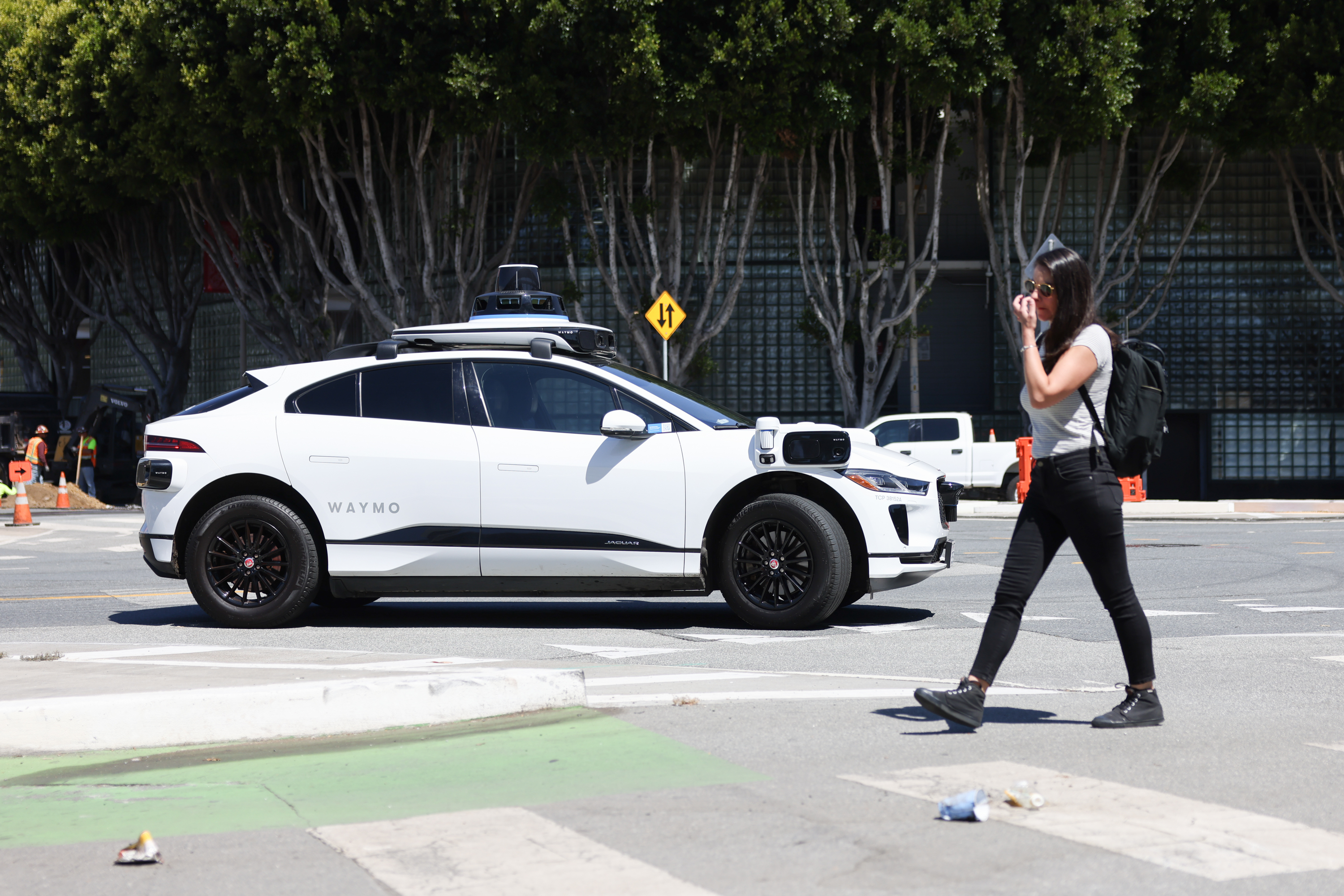 woman in front of waymo