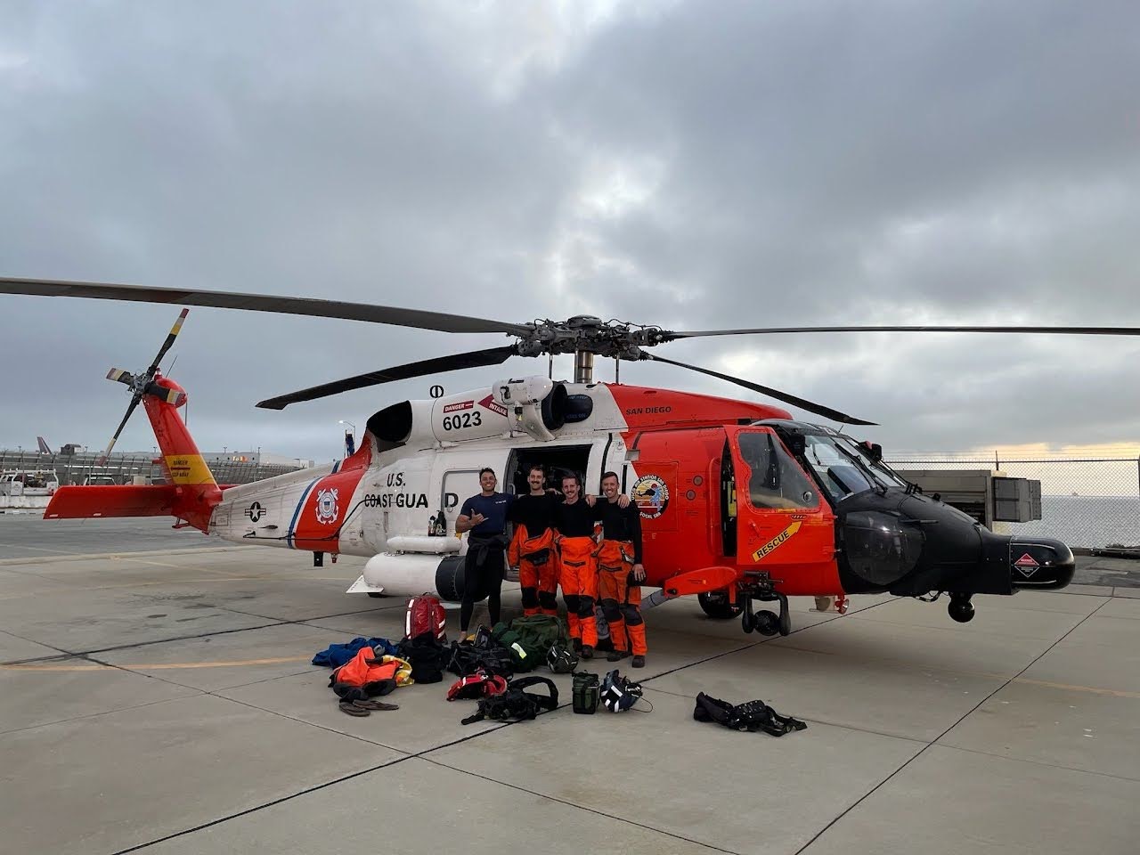 Coast Guard members Tyler Holt, Paul Junghans, Liam Otto and Joel Sprowls pose for a photo at Coast Guard Air Station San Francisco on August 17, 2021.