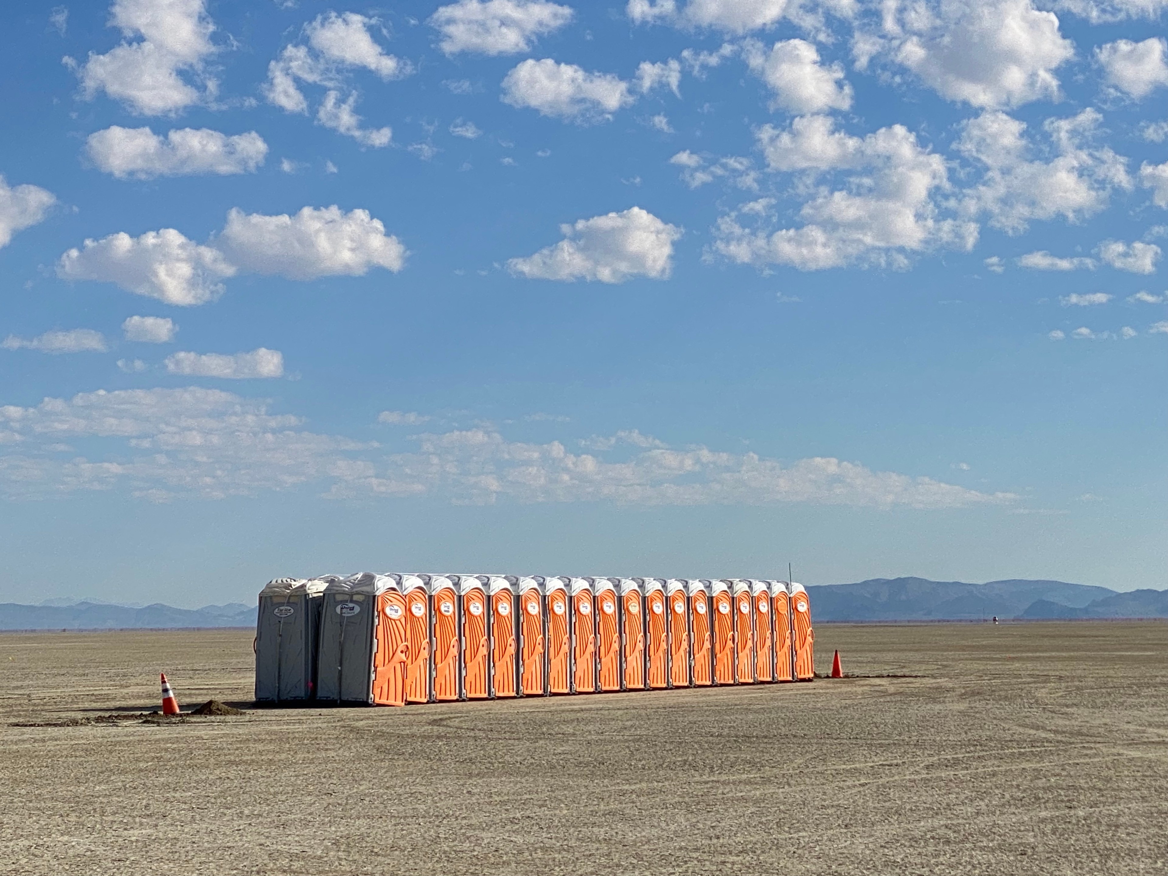 Portable toilets are lined up in the Nevada desert ahead of Burning Man 2023.