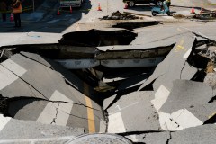a massive sinkhole in a city street