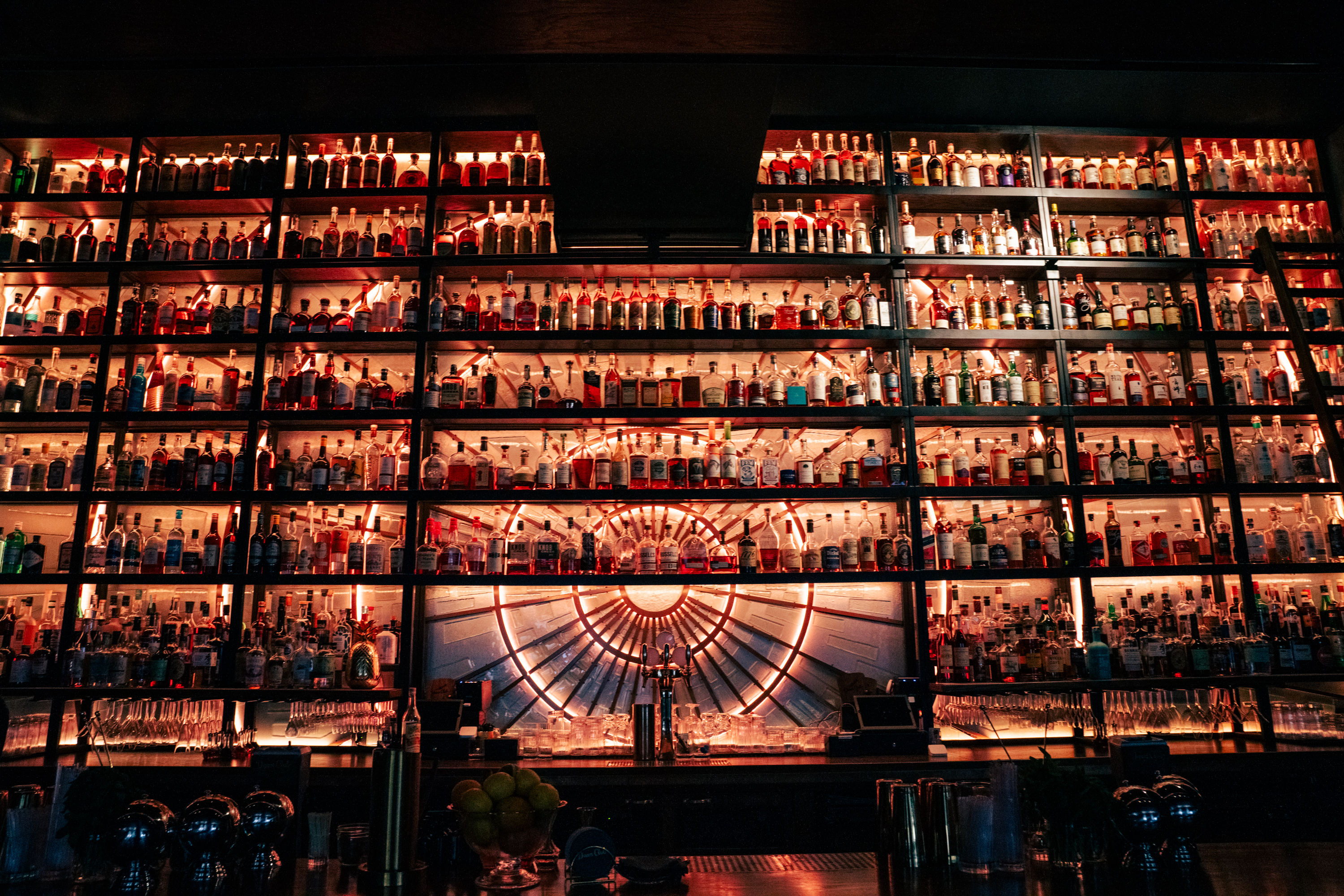 Dawn Club's prodigious selection of alcohol and mixers is seen behind the bar.