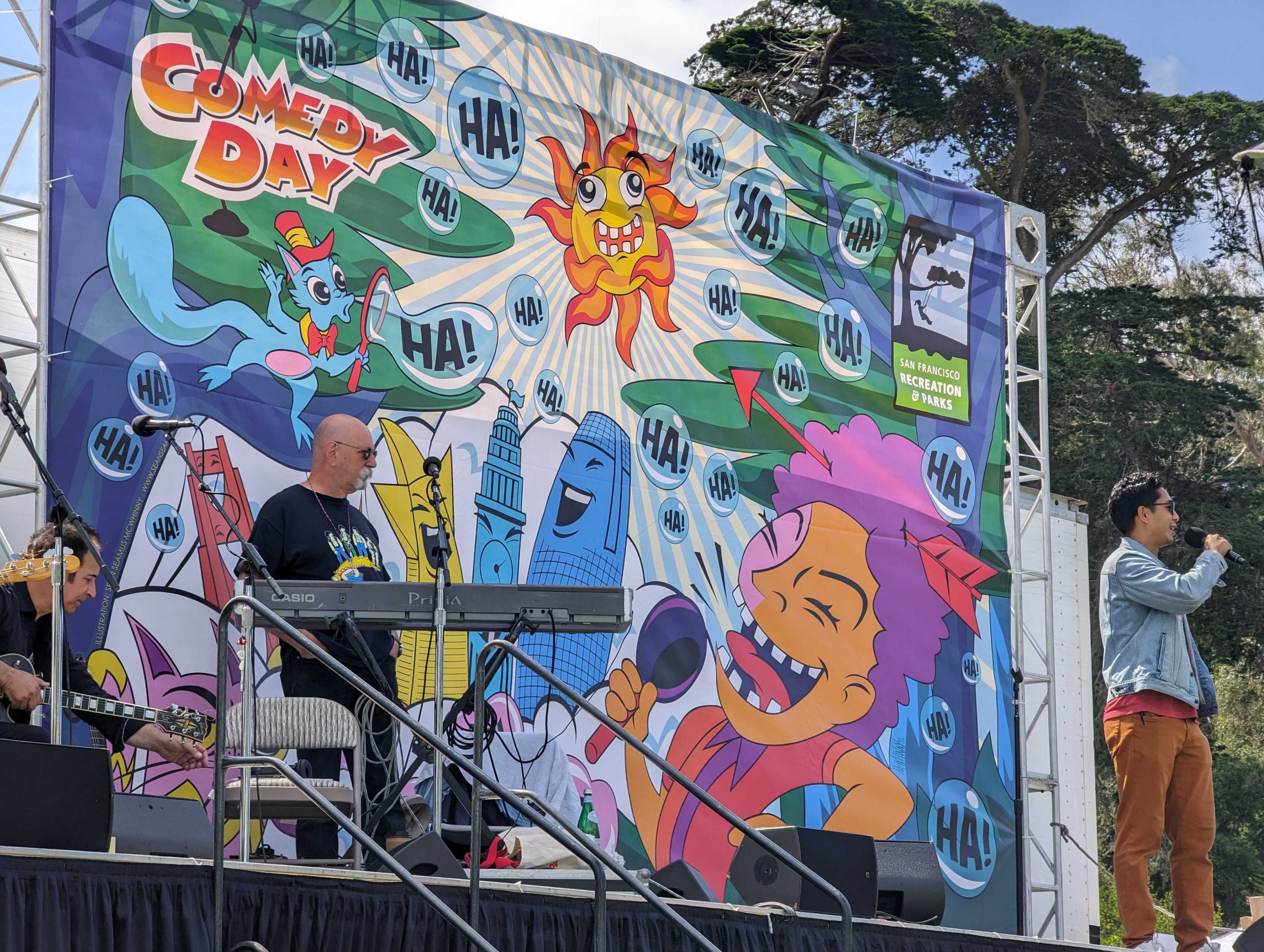 Comedian Leiroy Abueg cracks up the crowd Sunday at Golden Gate Park's Robin Williams Meadow during the Comedy Day in the Park festival