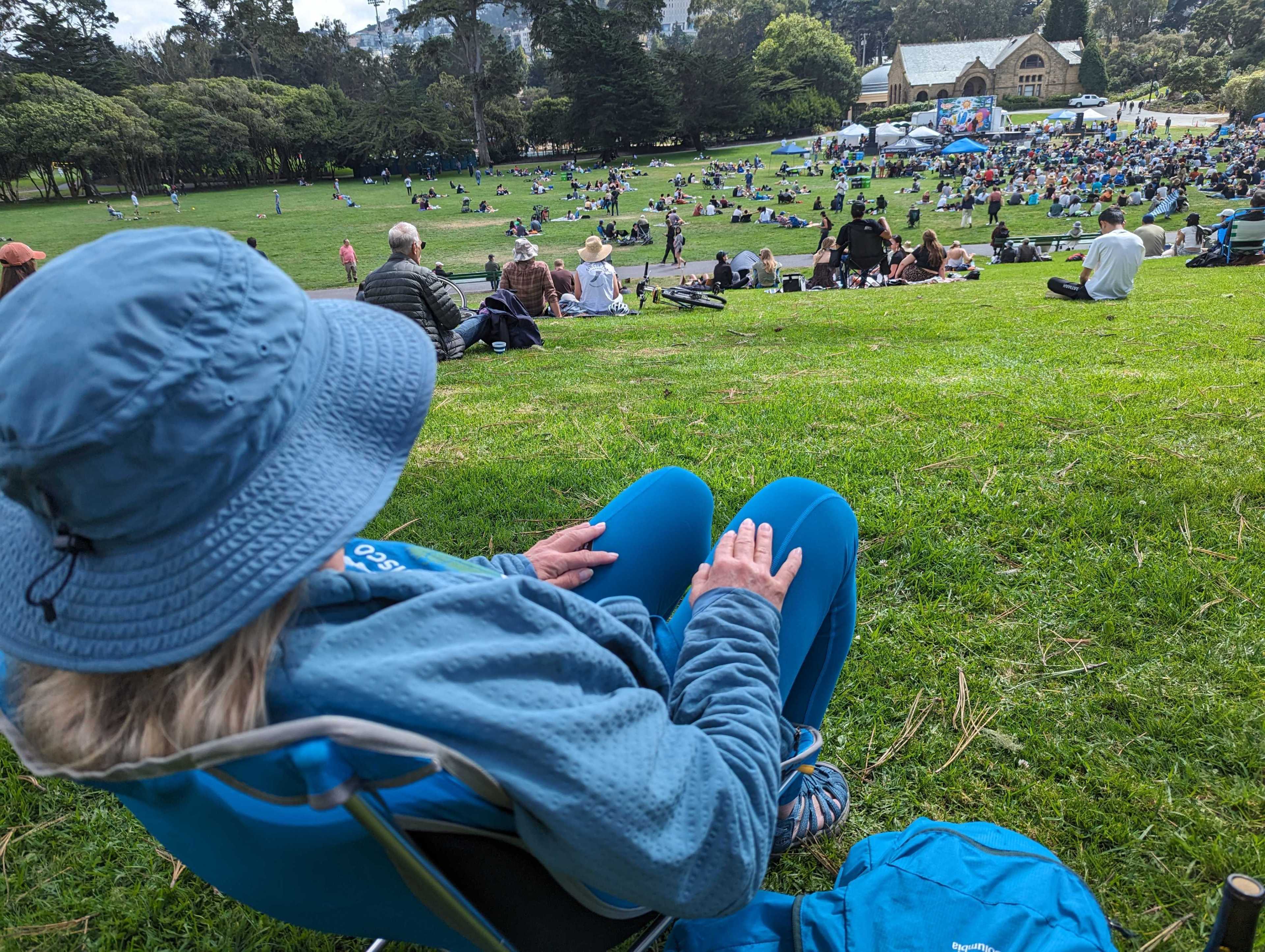 San Francisco resident Cyndi Bakir sits Sunday atop a hill at Golden Gate Park's Robin Williams Meadow while enjoying the 42nd Annual Comedy Day in the Park festival.