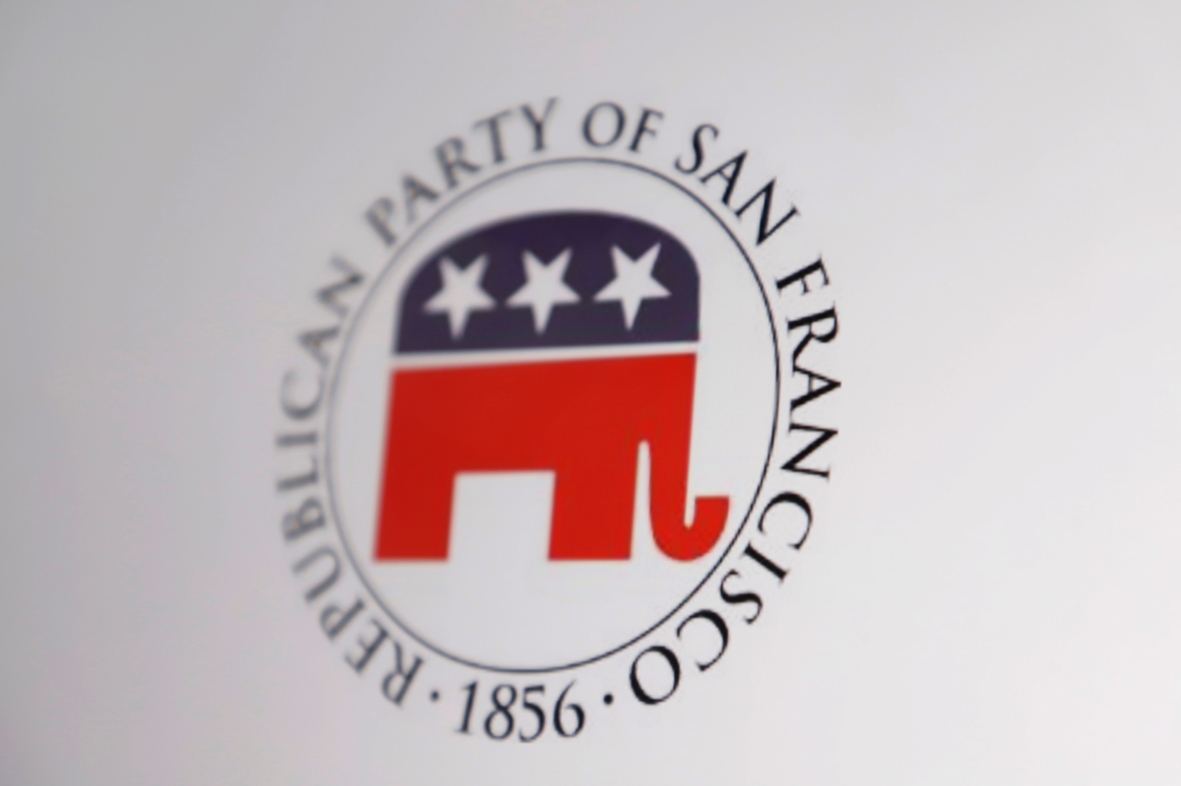 The image shows the logo of the Republican Party of San Francisco. It features a red elephant with three white stars on a blue background, encircled by text.