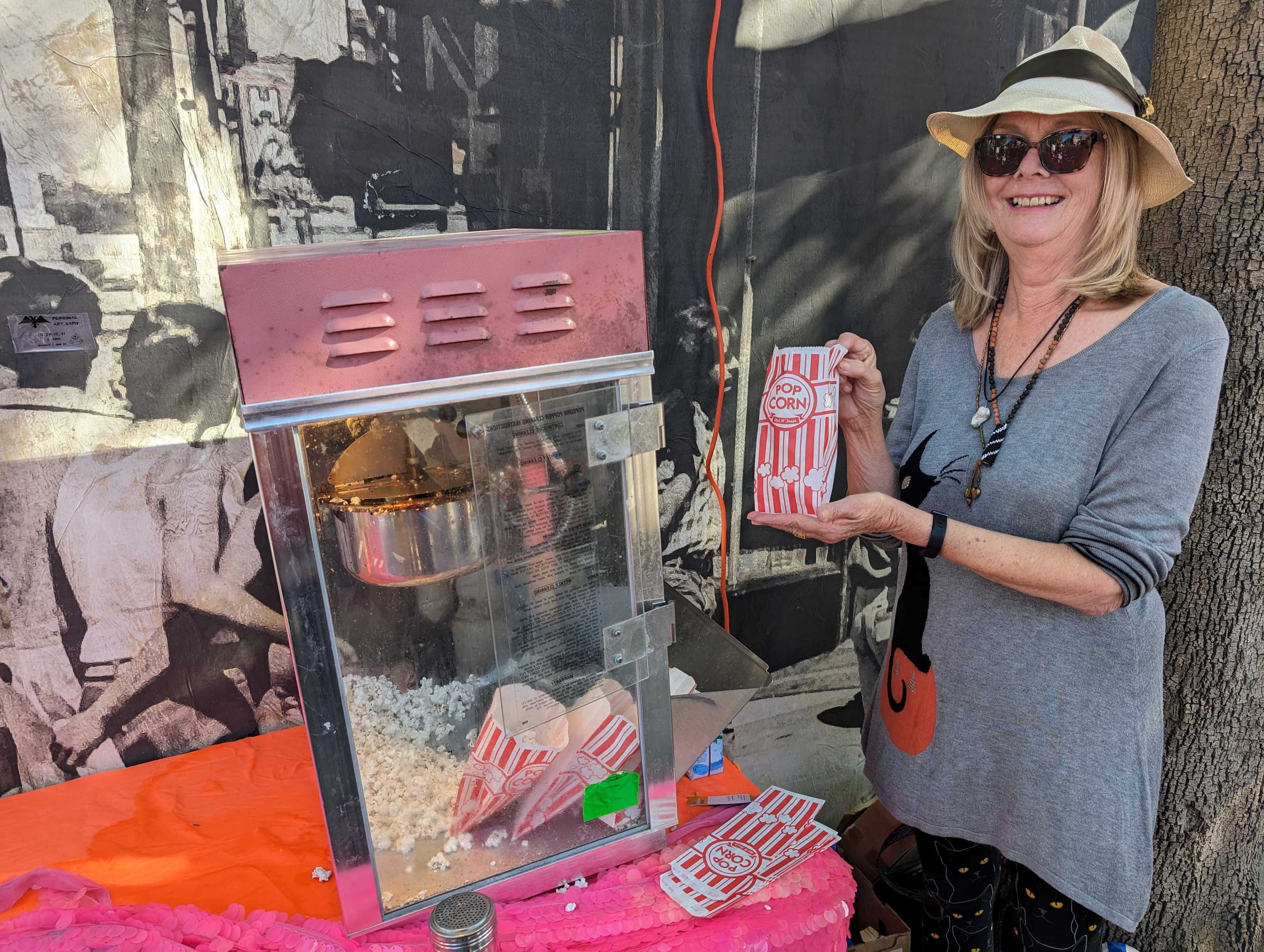 Susan Porter Beckstead worked a popcorn machine Sunday at a Halloween block party at Market and Noe streets.