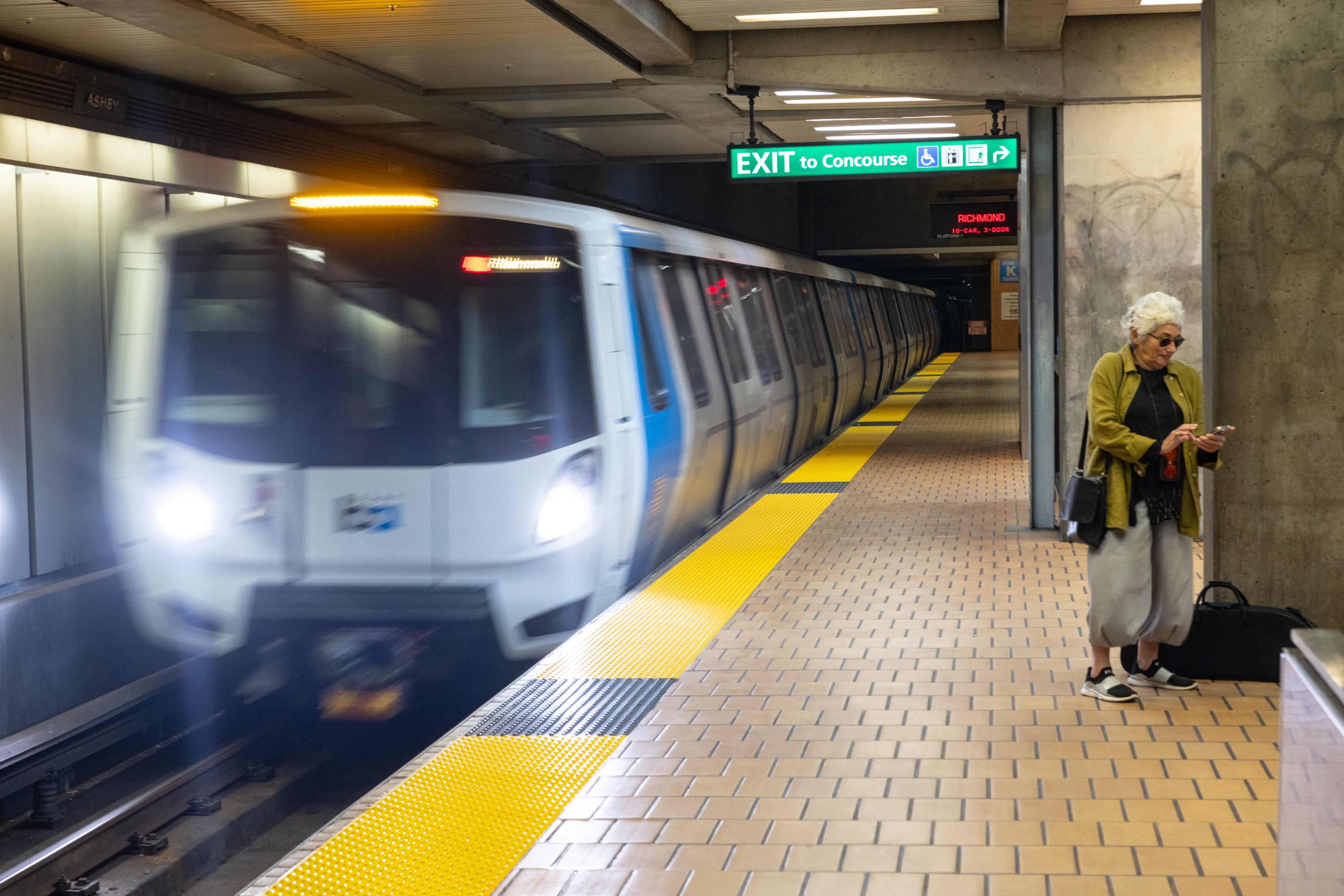 A bart train enters the station