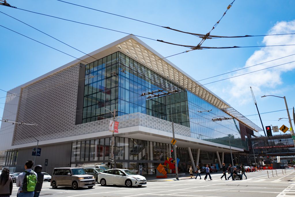 The facade of the Moscone convention center is glass and metal.