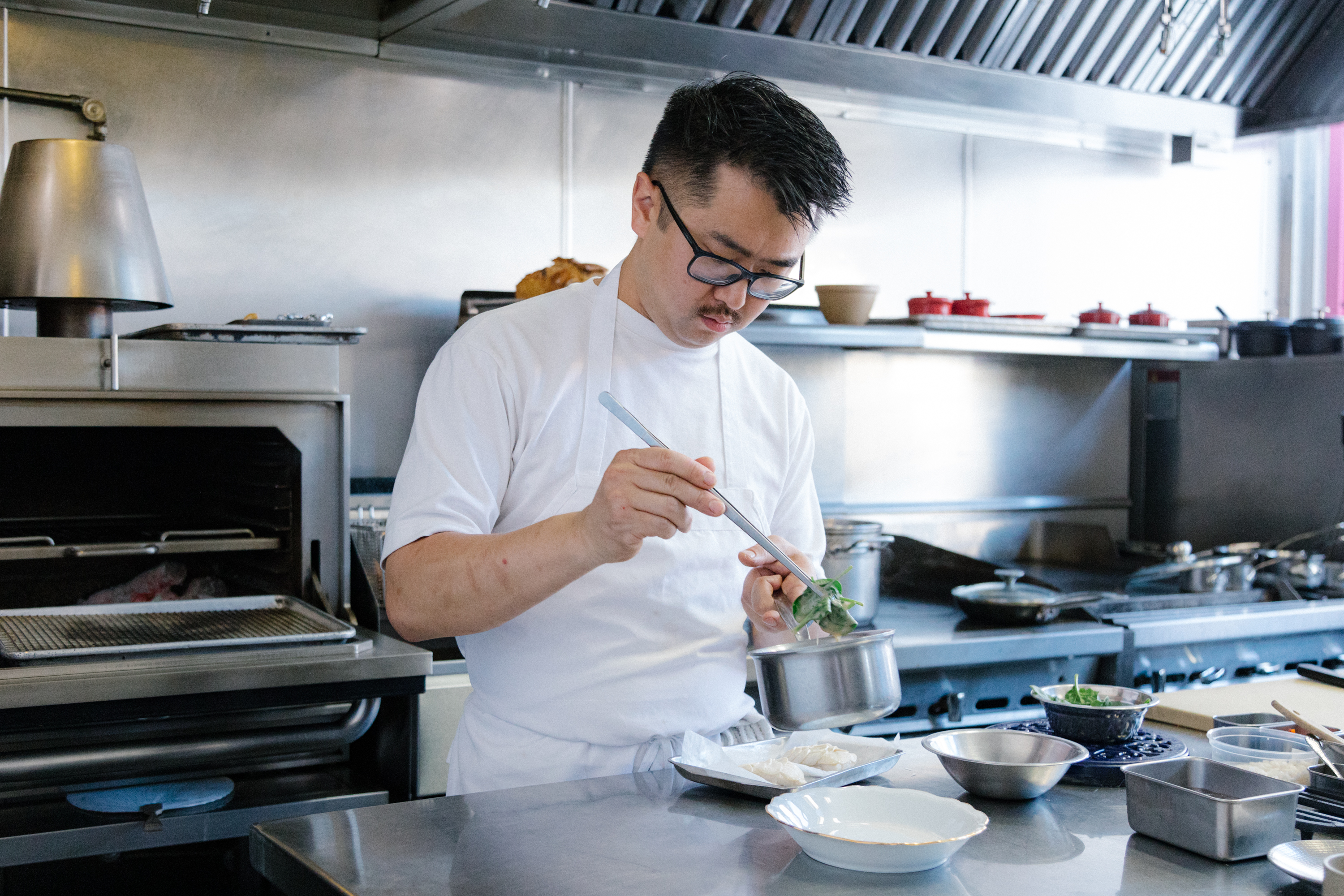 Chef Nathan Matkowsky cooks a dish in the kitchen of San Francisco restaurant Lord Stanley.