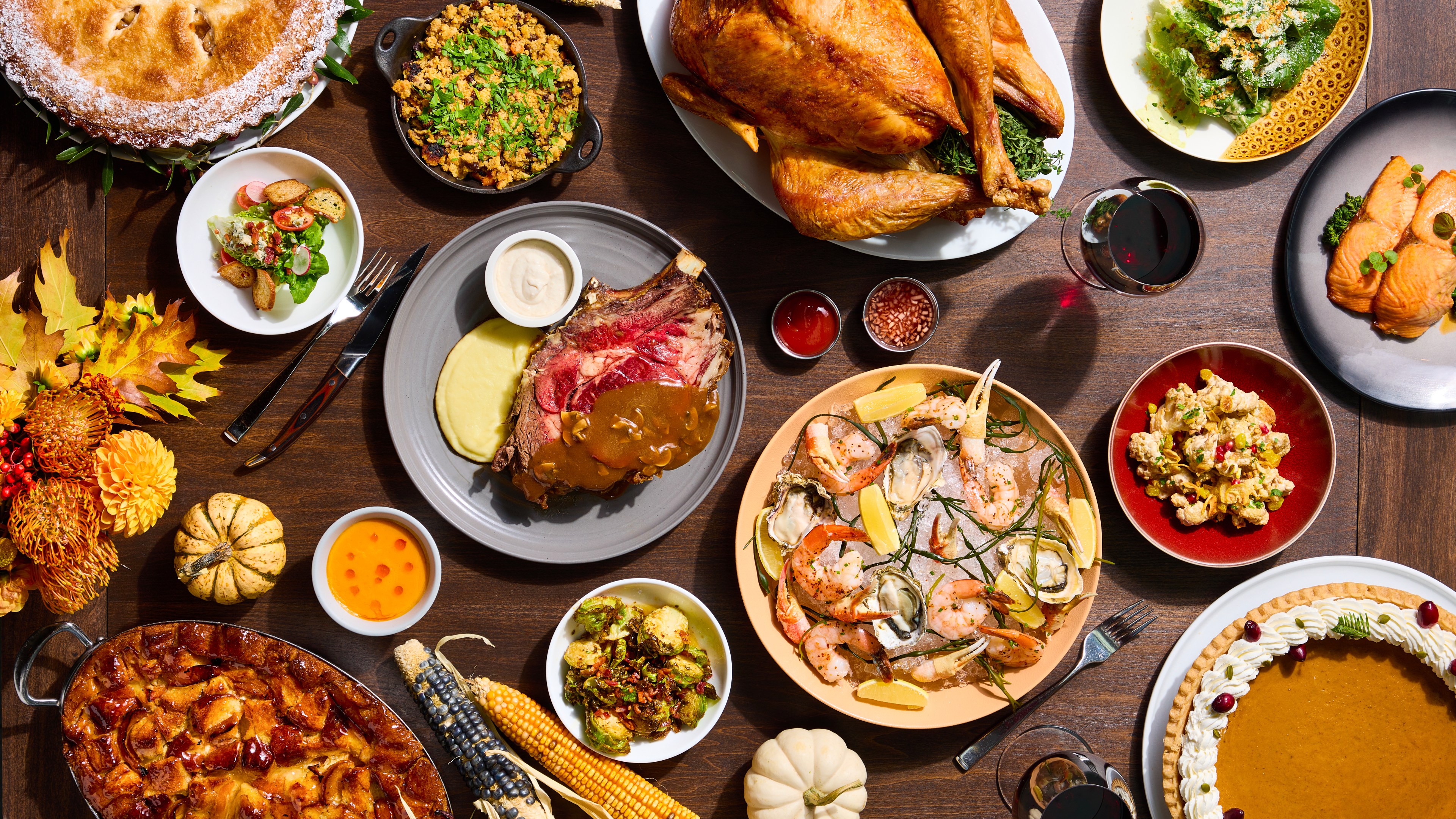 A spread of decadent dishes by San Francisco restaurant International Smoke House is laid out on a table and features turkey, chilled shellfish and various Thanksgiving sides.