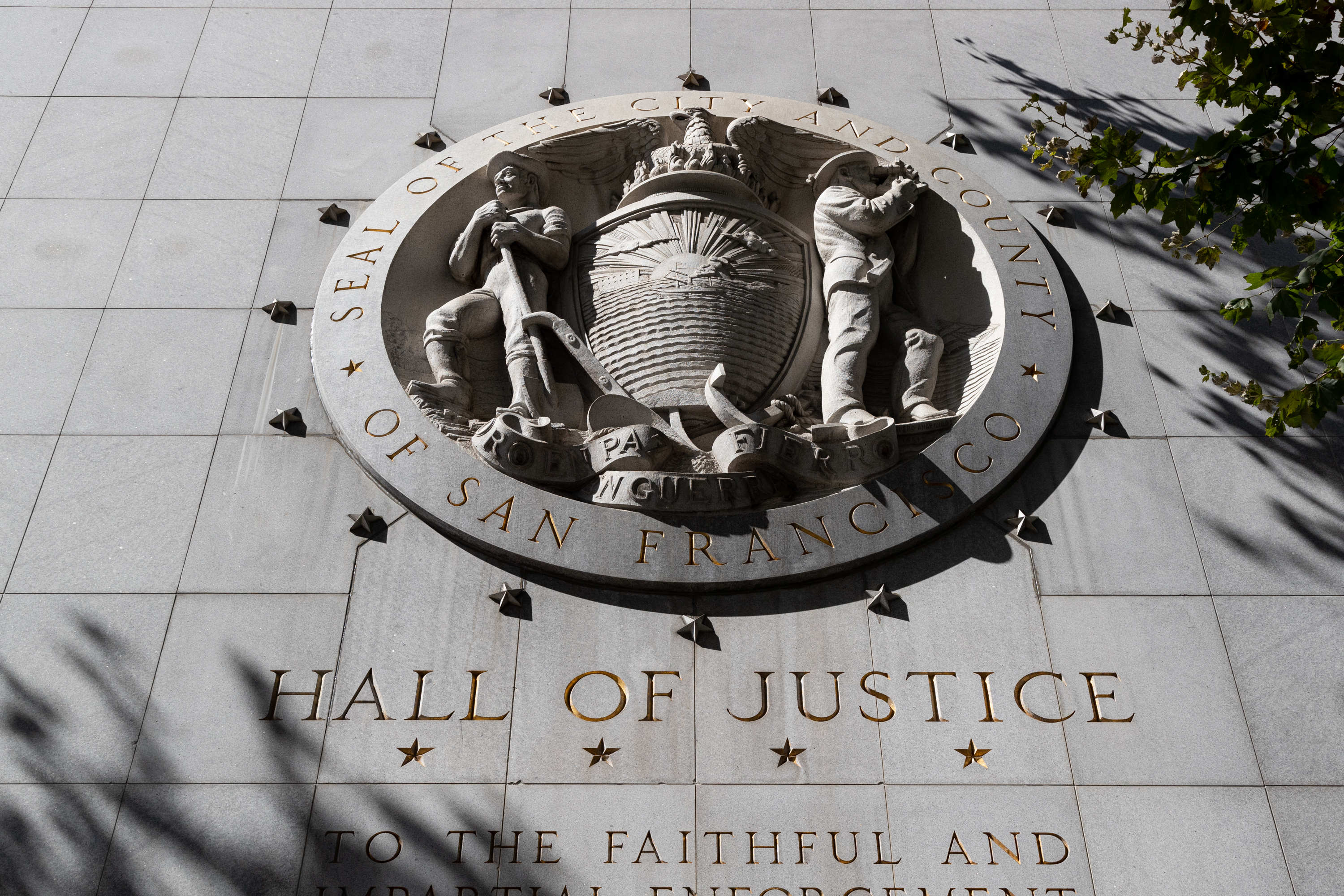 A stone relief of the San Francisco Superior Superior Court insignia.