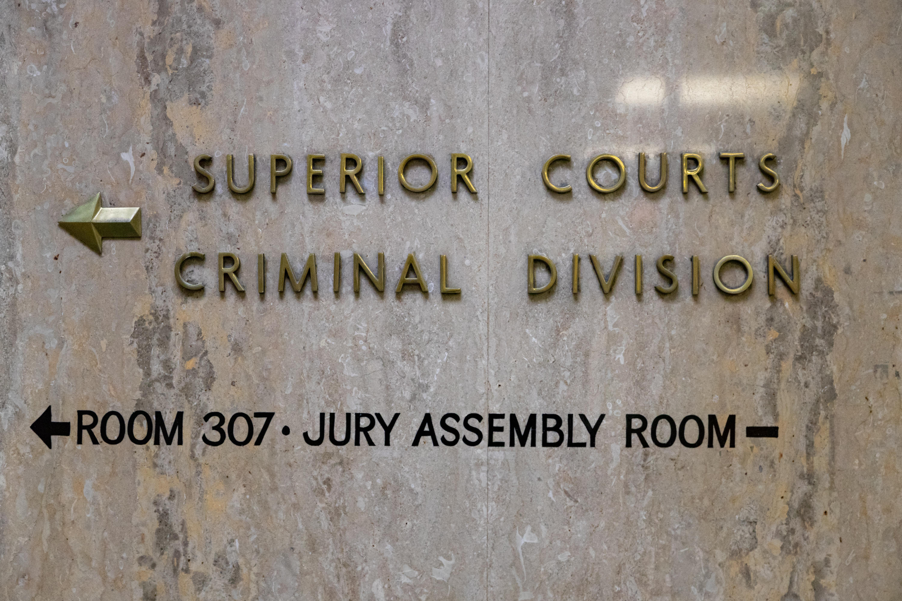 A marble wall with the words Superior Court Criminal Division