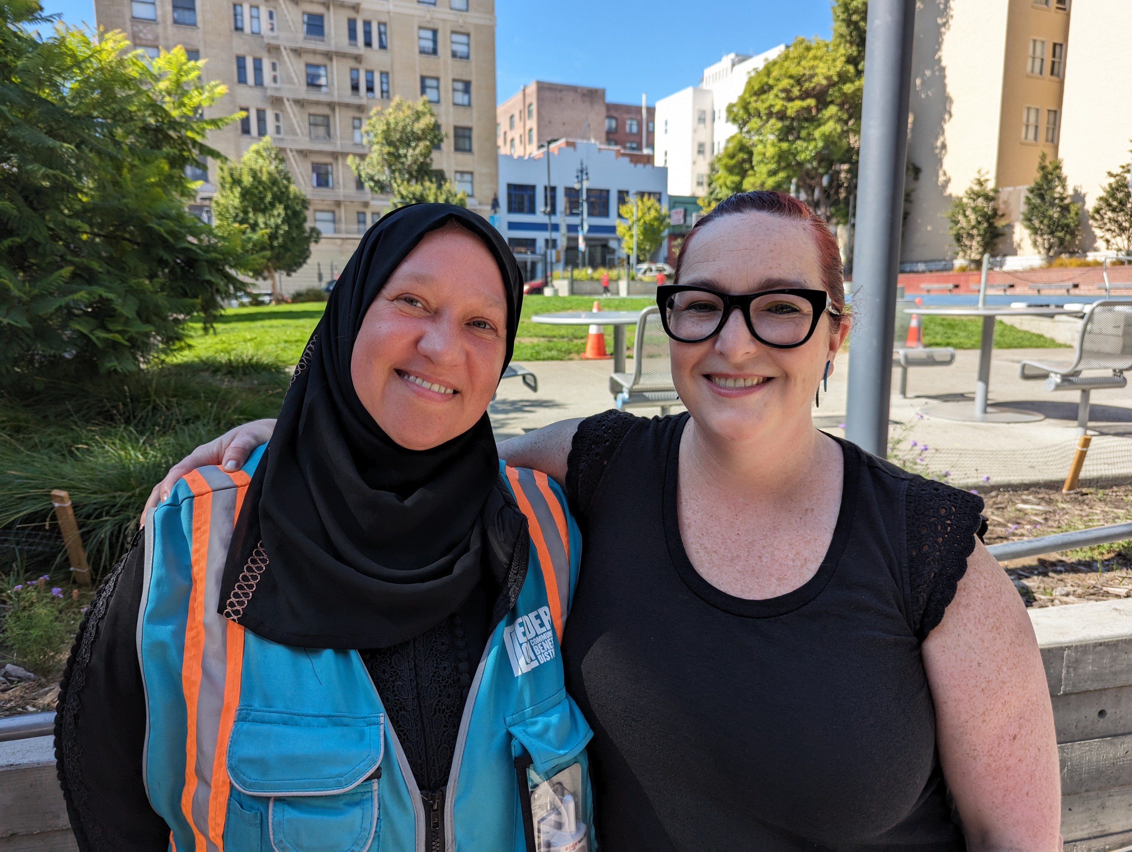 Tatiana Alabsi, program manager for Safe Passage, and Kate Robinson, executive director for the Tenderloin Community Benefit District, attend a community gathering at Boeddeker Park's clubhouse in the city's Tenderloin neighborhood Sunday.