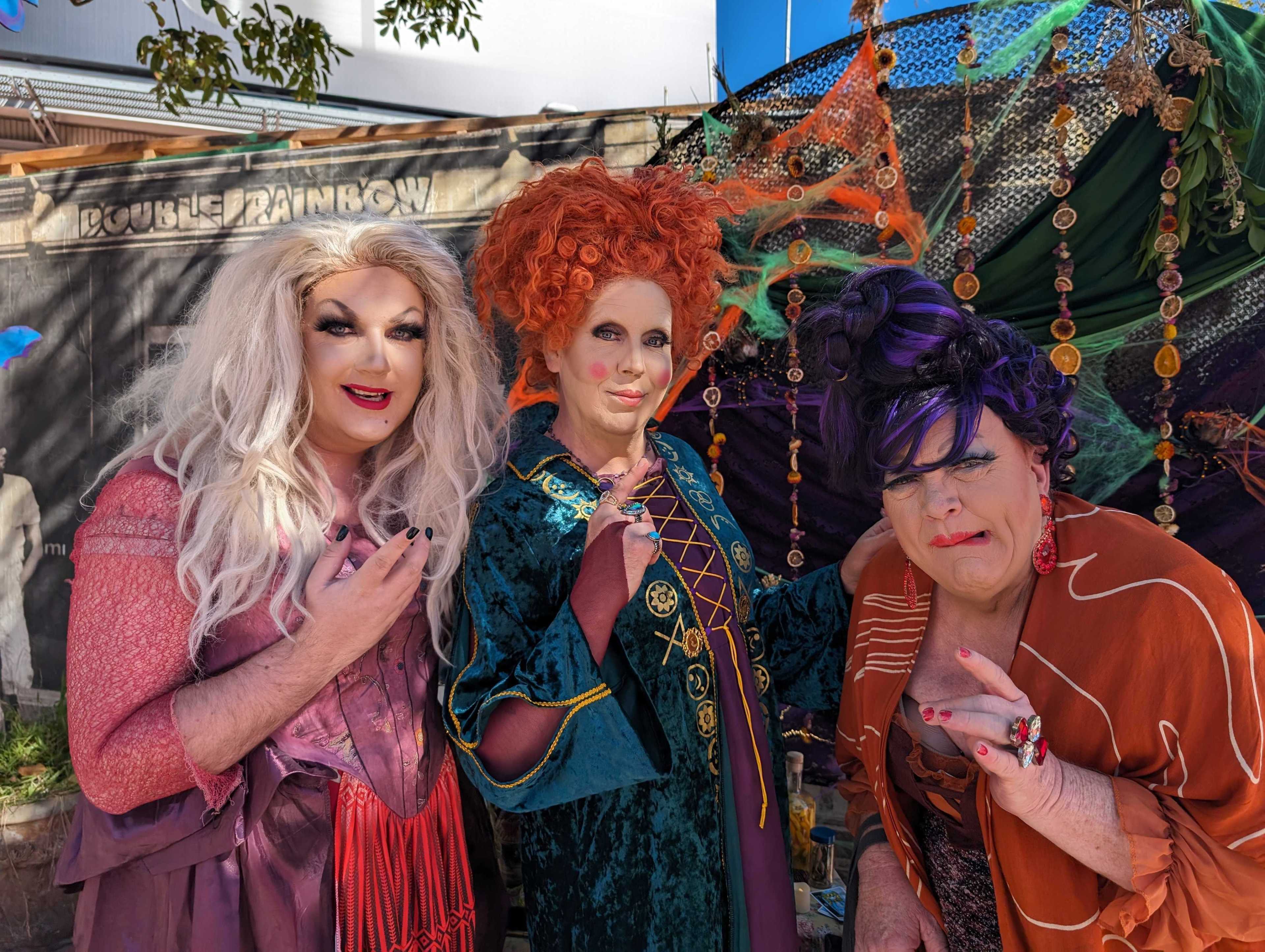 Three Queens Are We troupe members Kelly Rose, Christina Ashton and Oliva Hart handed out candy and greeted Halloween block partiers Sunday at Market and Noe streets.