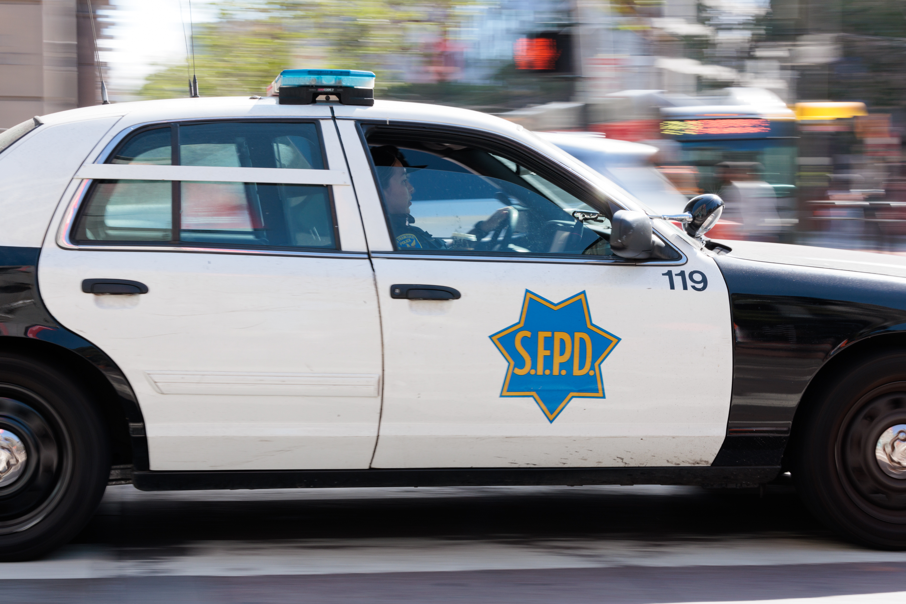 A San Francisco police car is seen driving at speed.