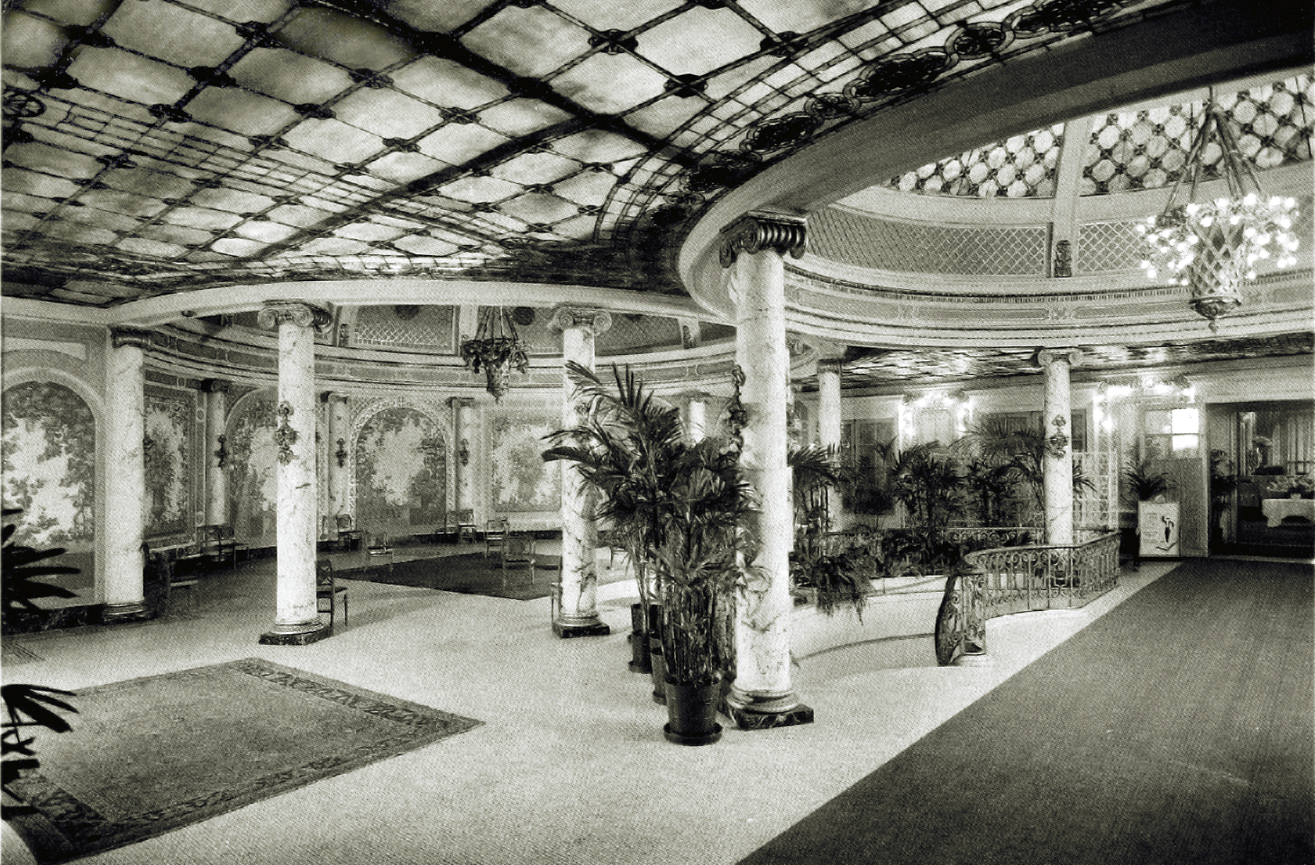 A historic photo showing the interior atrium of the hotel.