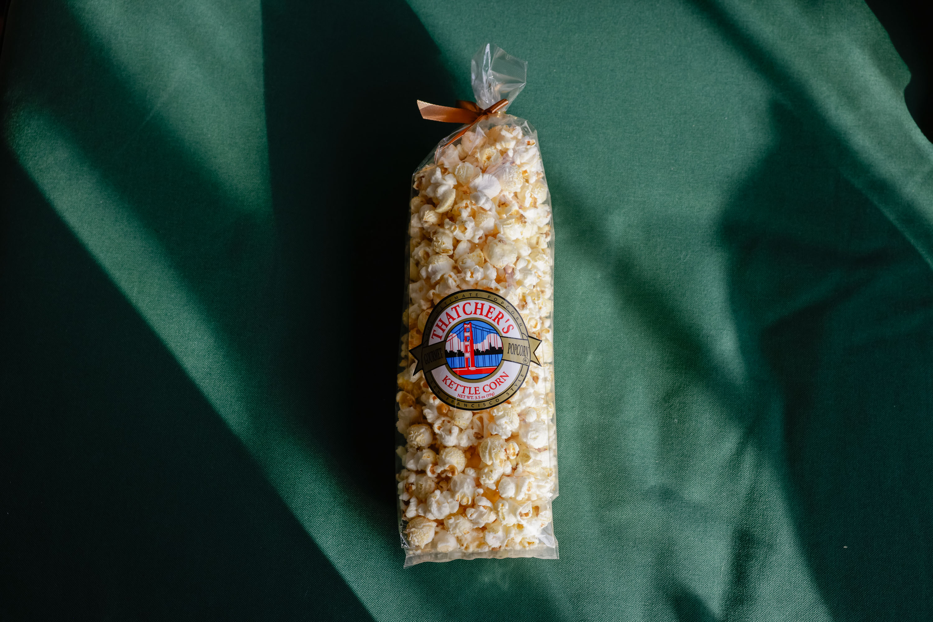 A top-down product shot of a bag of Tahtchers Kettle corn.