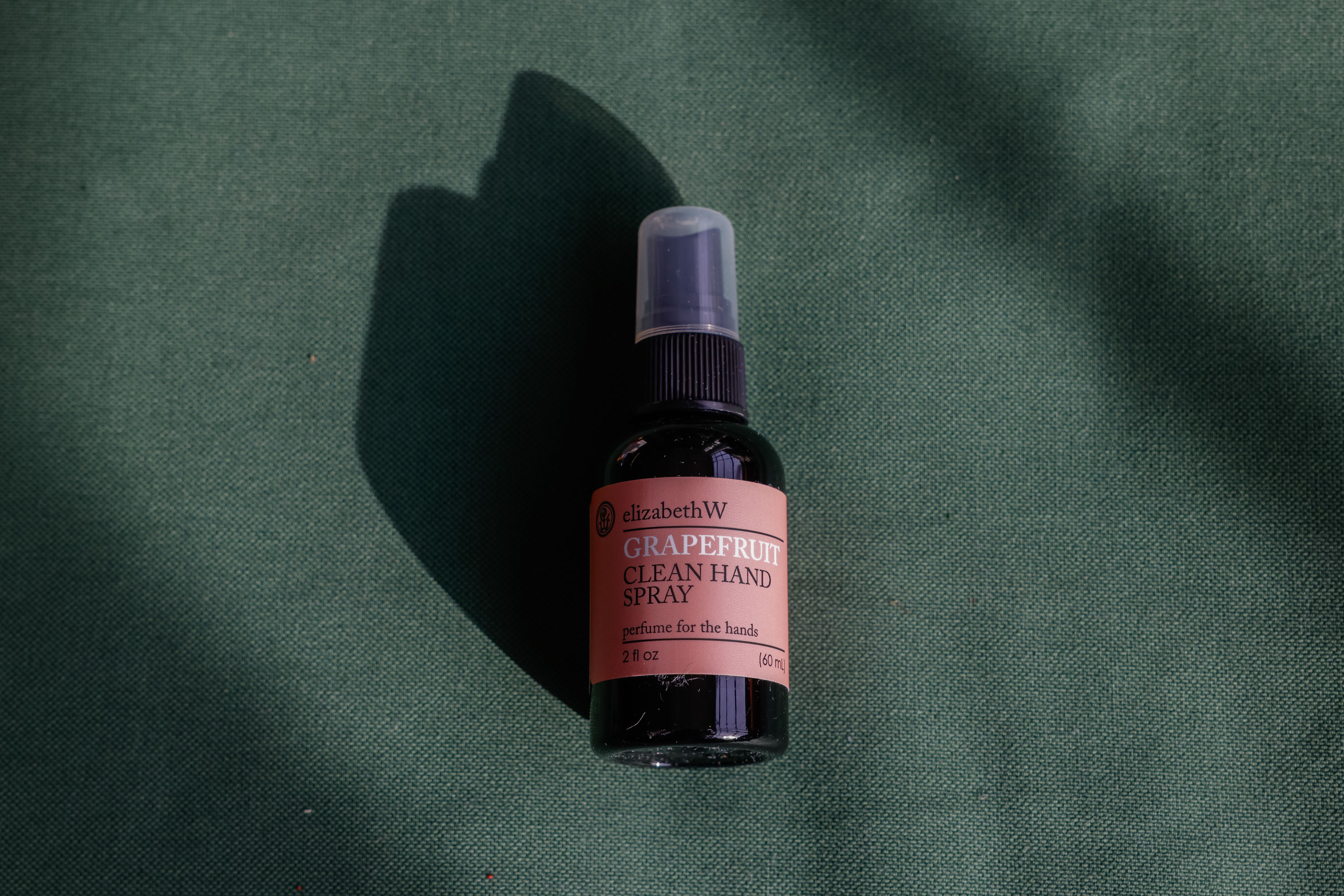 A top-down product shot of elizabethW hand sanitizer.