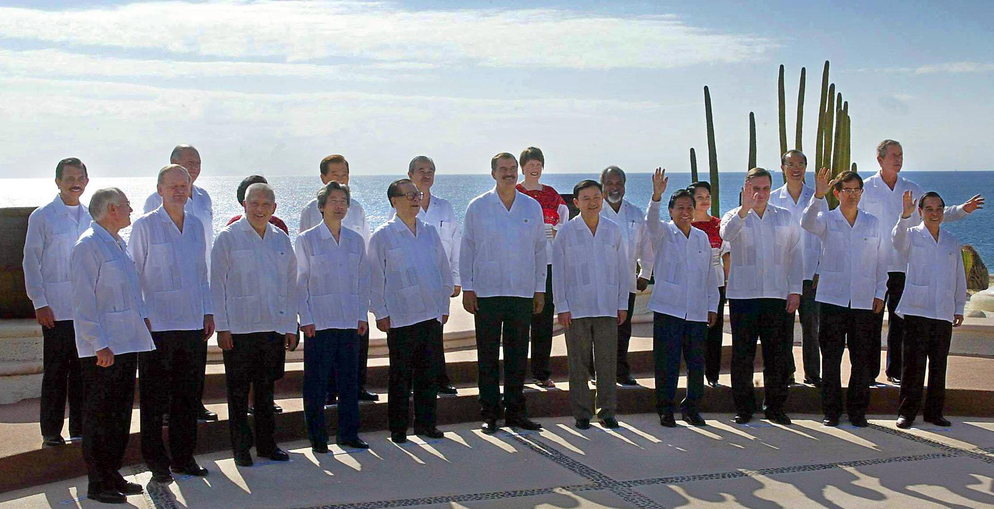 A group of world leaders are dressed in traditional Mexican attire for a portrait.