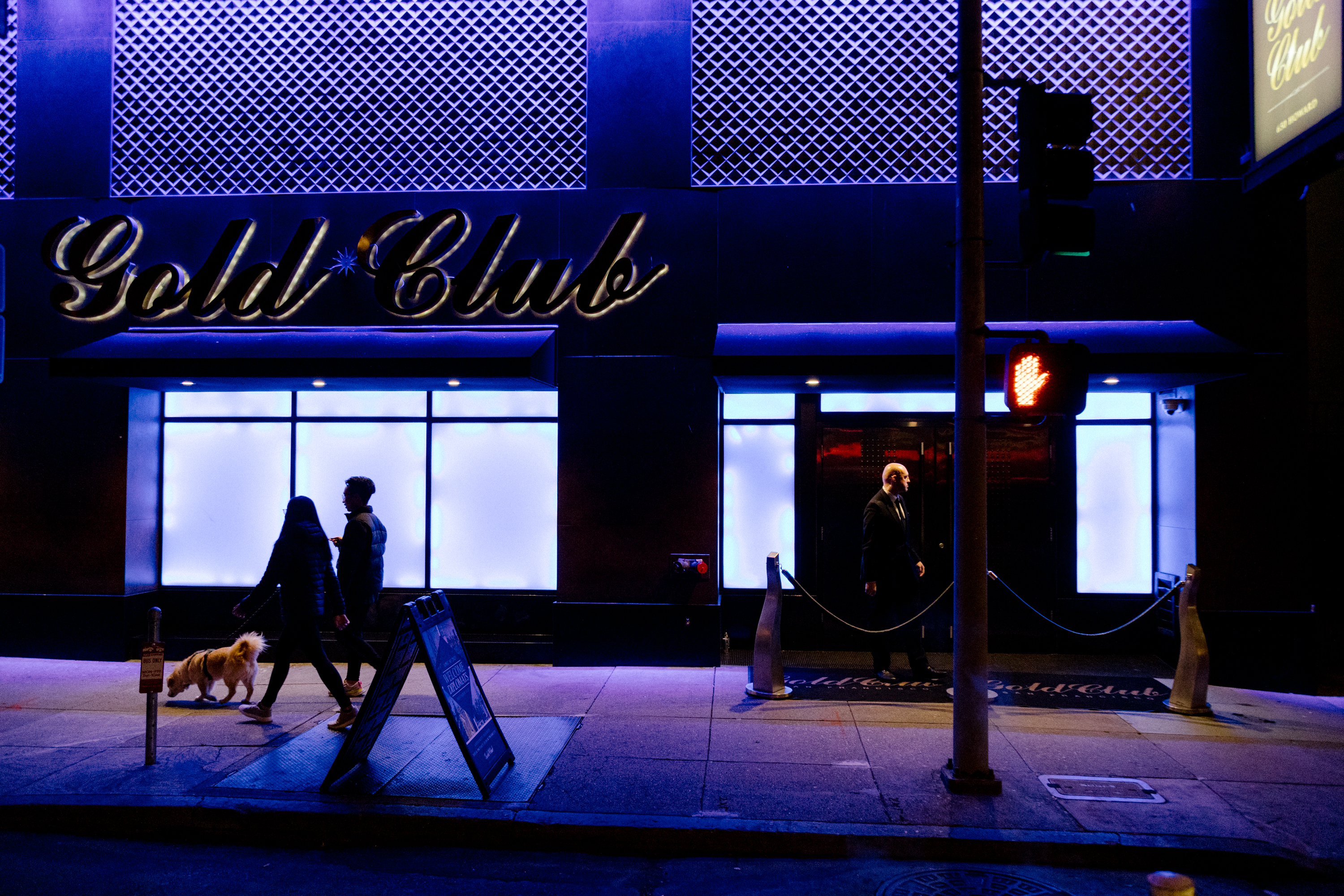 An exterior of a club with signage that reads Gold Club.
