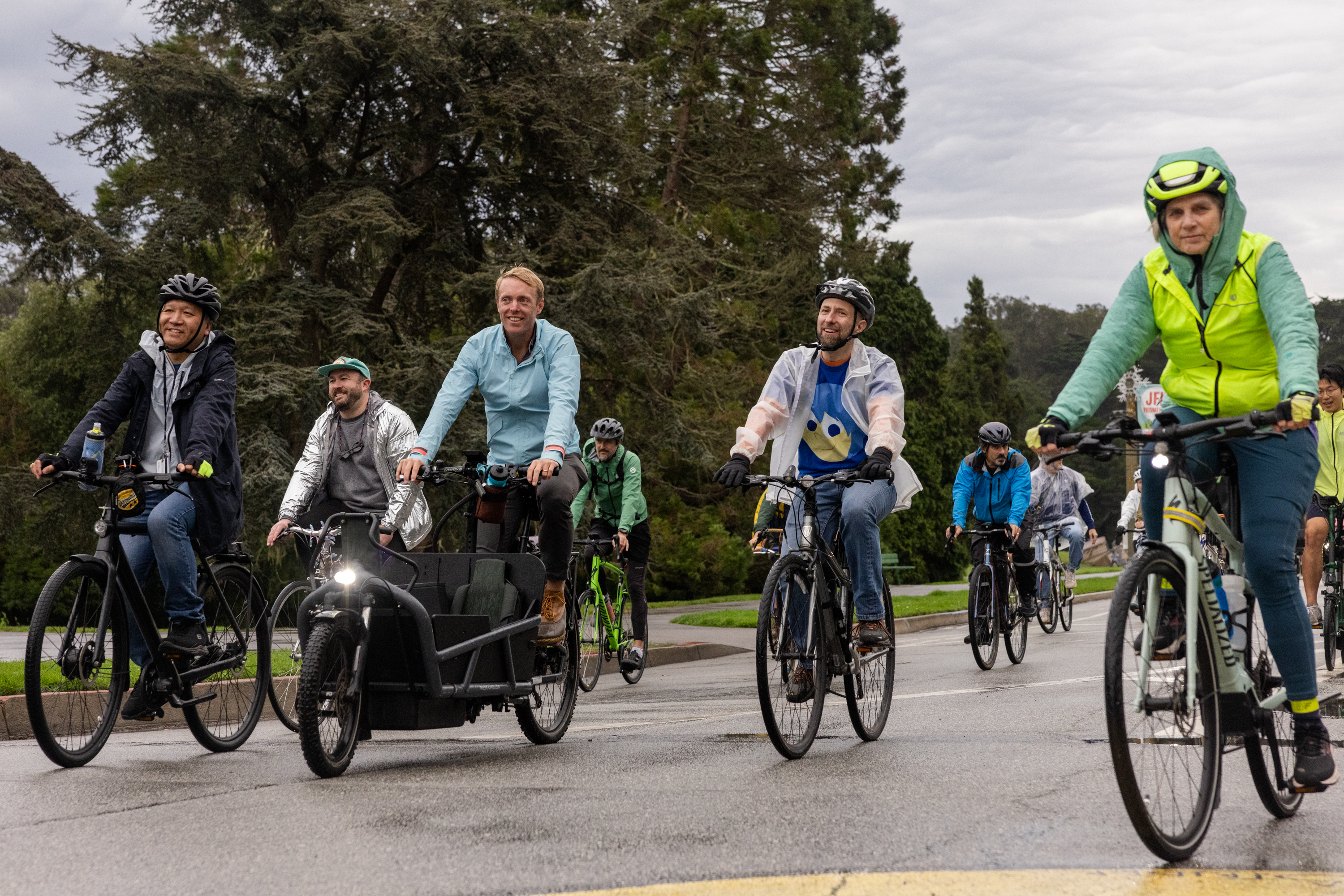 City Supervisor Joe Engardio rides his bike surrounded by other bikers through Golden Gate Park.