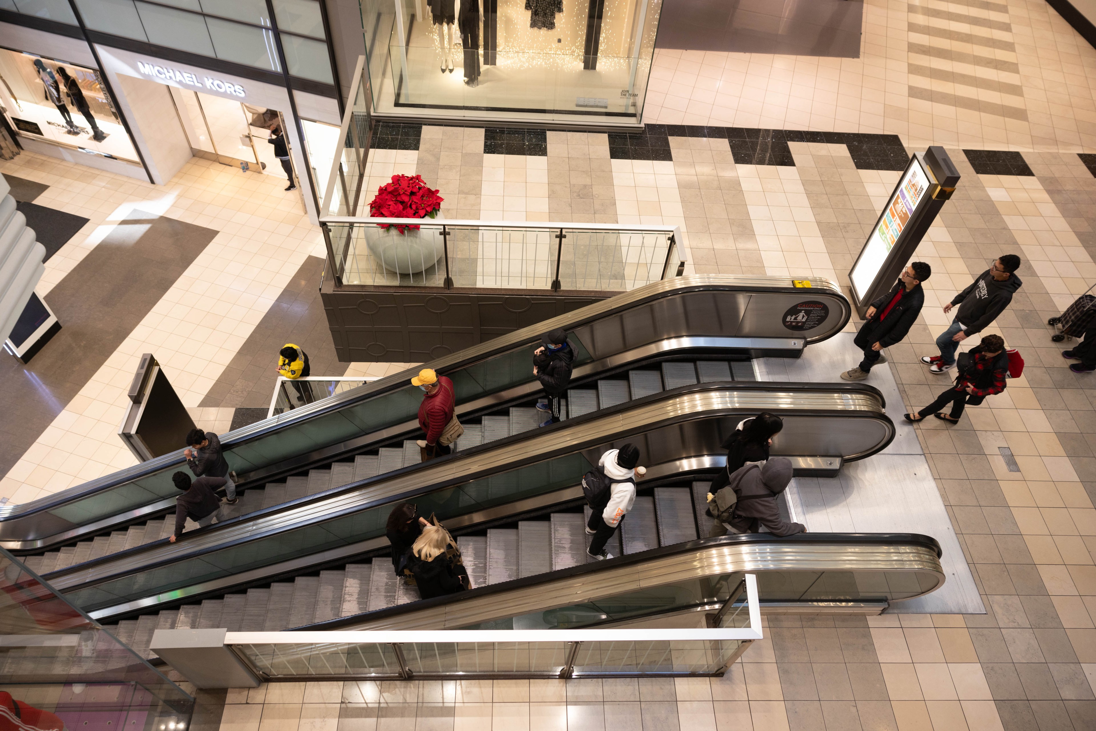 Shoppers use the escalator in San Francisco Centre.