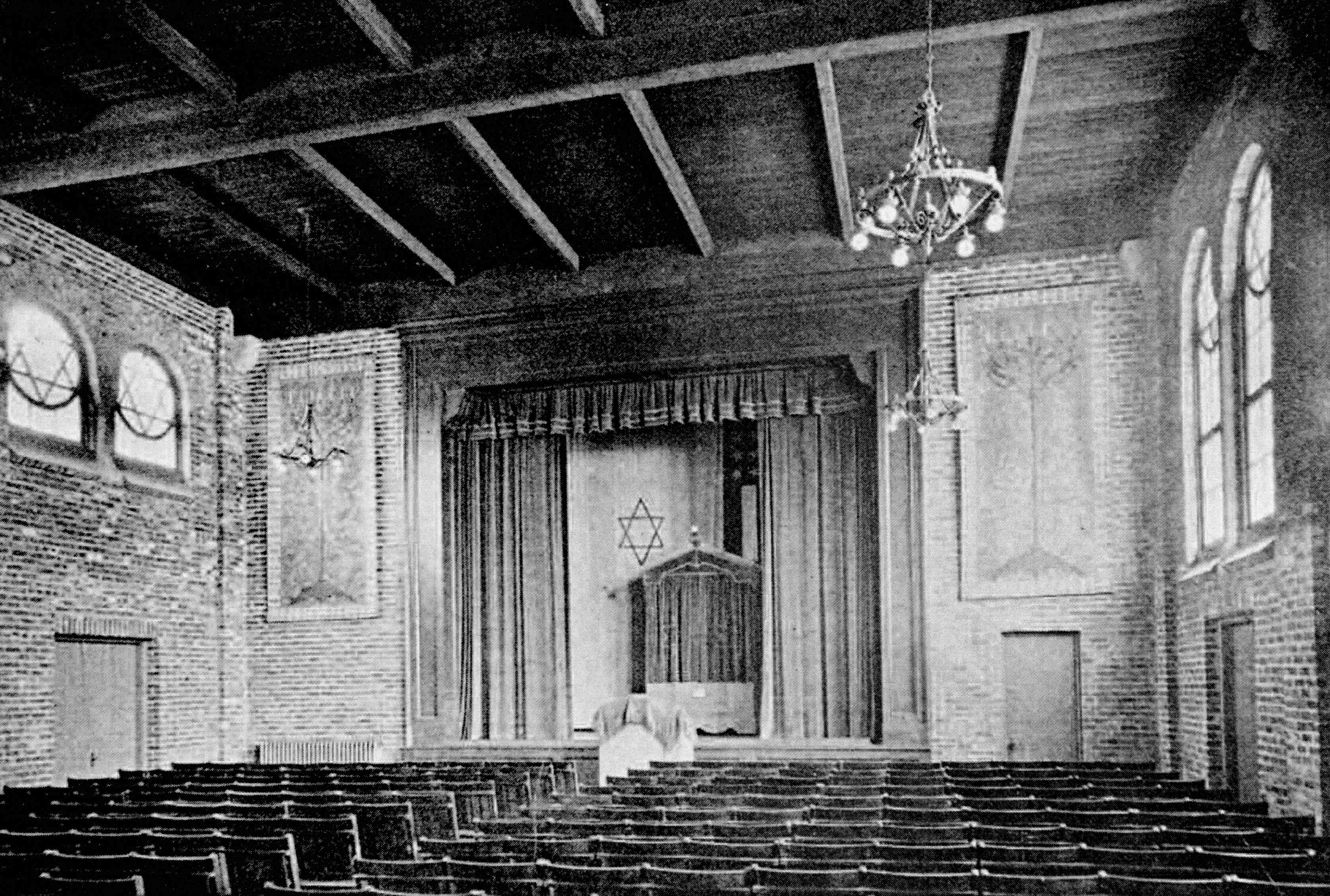 A historical picture that is black and white of inside the Alper Memorial Building, the Jewish synagogue.
